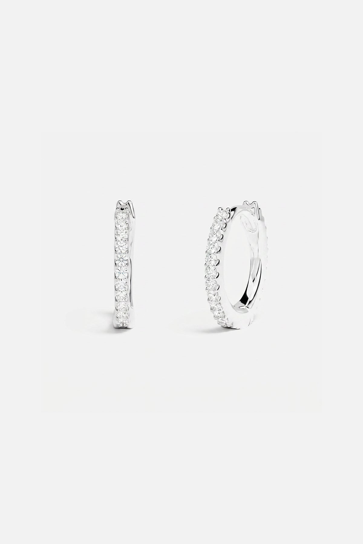 APM Hoop Earrings in rhodium finish, a delicate sparkle for effortless everyday elegance.