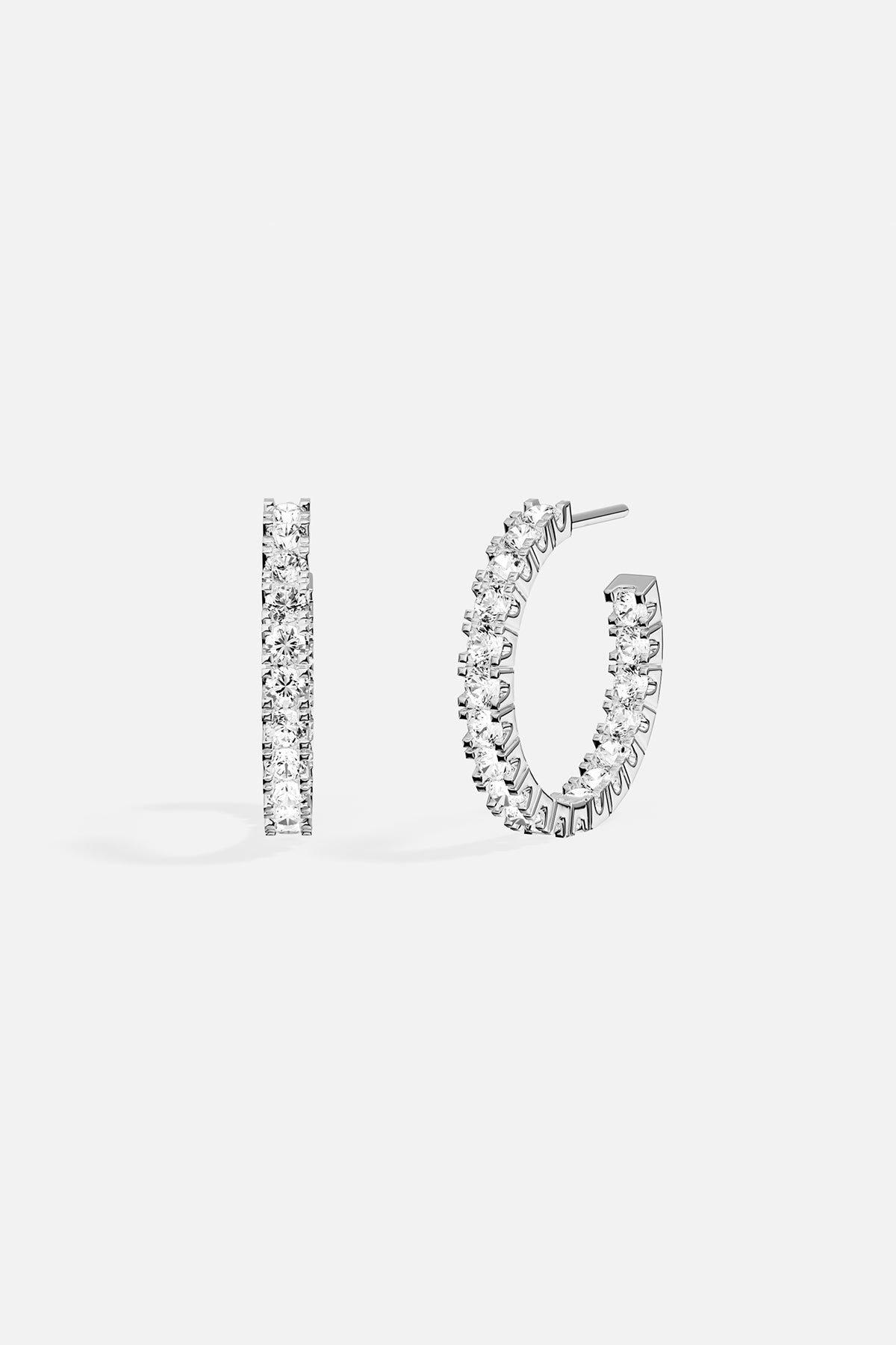APM Hoop Earrings, a radiant arc of light and effortless elegance.