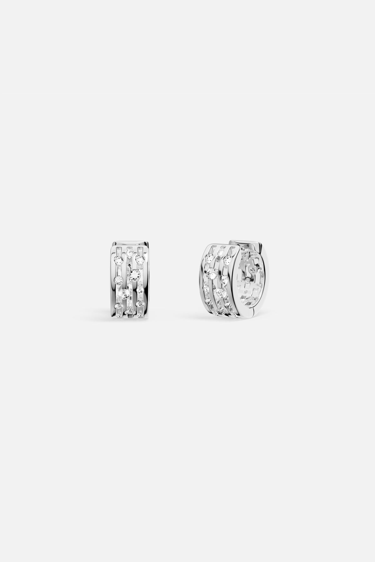 APM Hoop Earrings in rhodium finish, sparkling with modern architectural elegance.