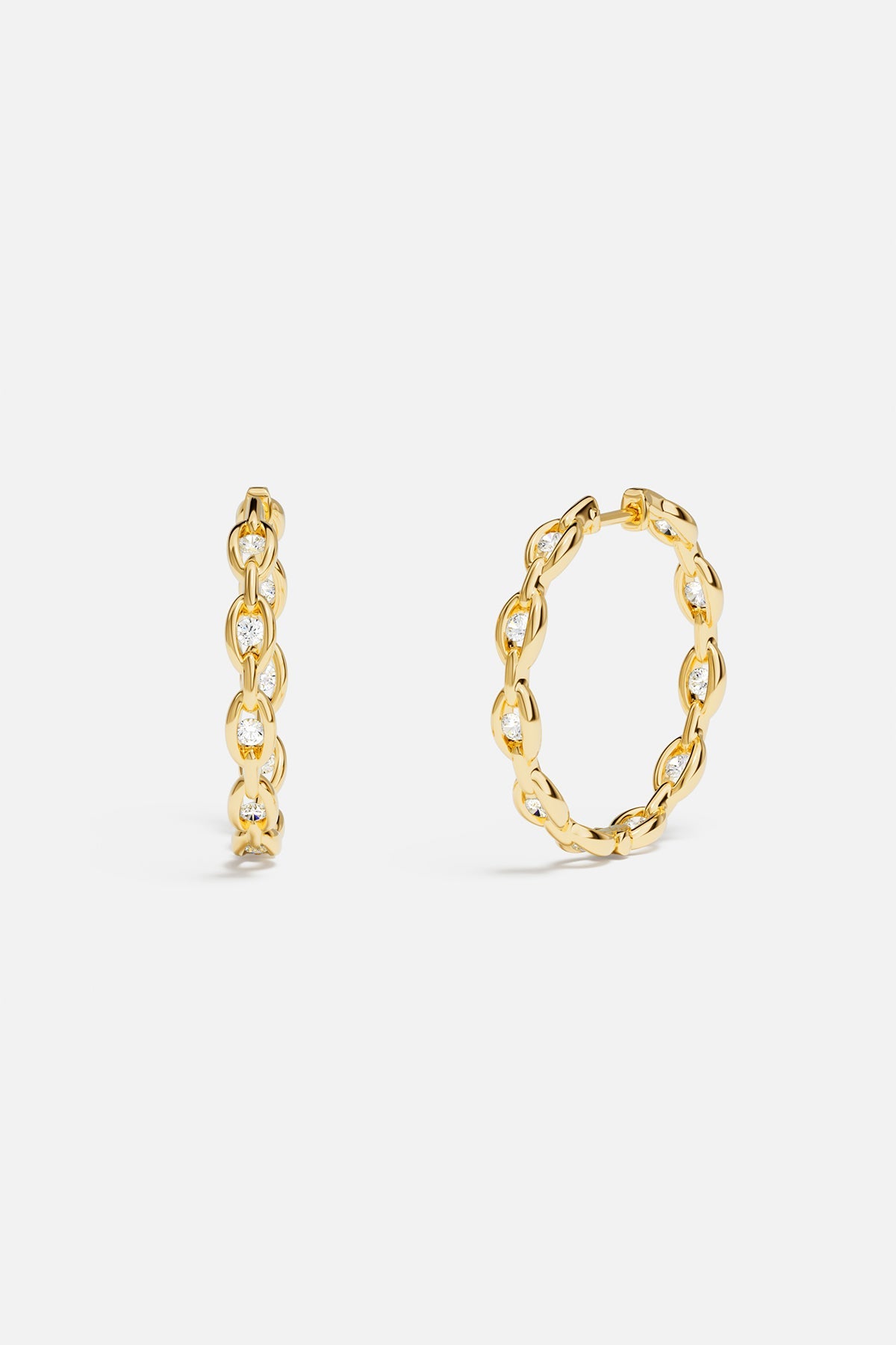 APM Hoop Earrings, golden links and shimmering stones for effortless radiance.