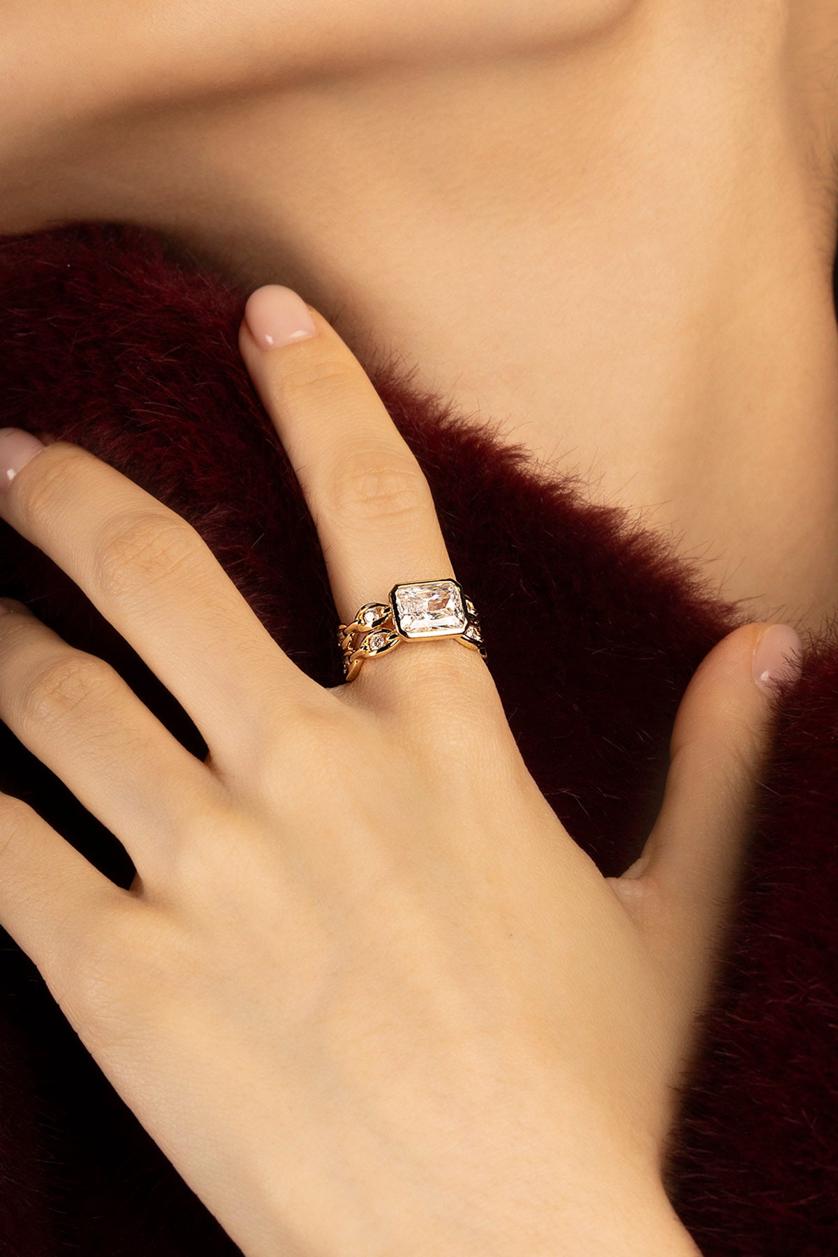 Woman wearing APM ring, a golden statement of quiet, contemporary allure.