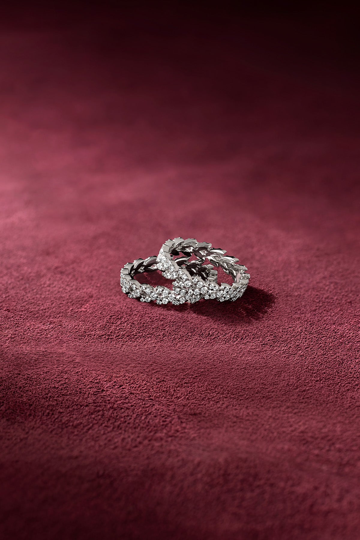 APM Rings shimmer on velvet, a delicate dance of light and elegance.