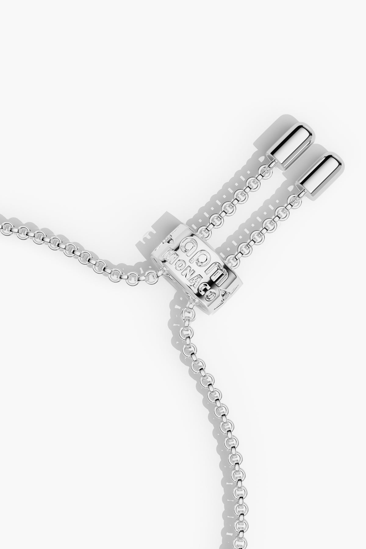 APM adjustable chain bracelet in rhodium finish, effortless elegance with a signature charm.