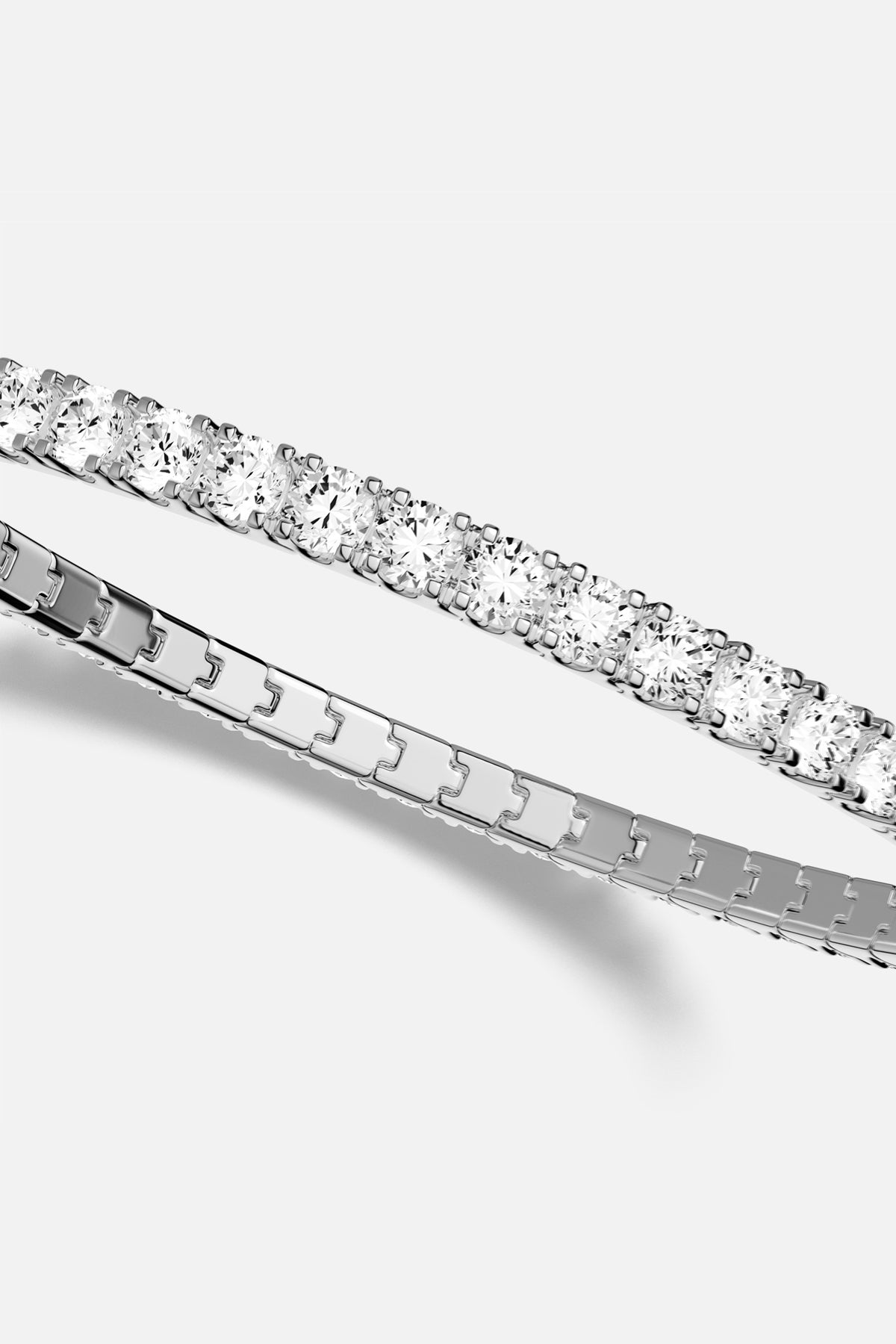 APM Tennis Bracelet, a timeless sparkle with rhodium finish elegance.