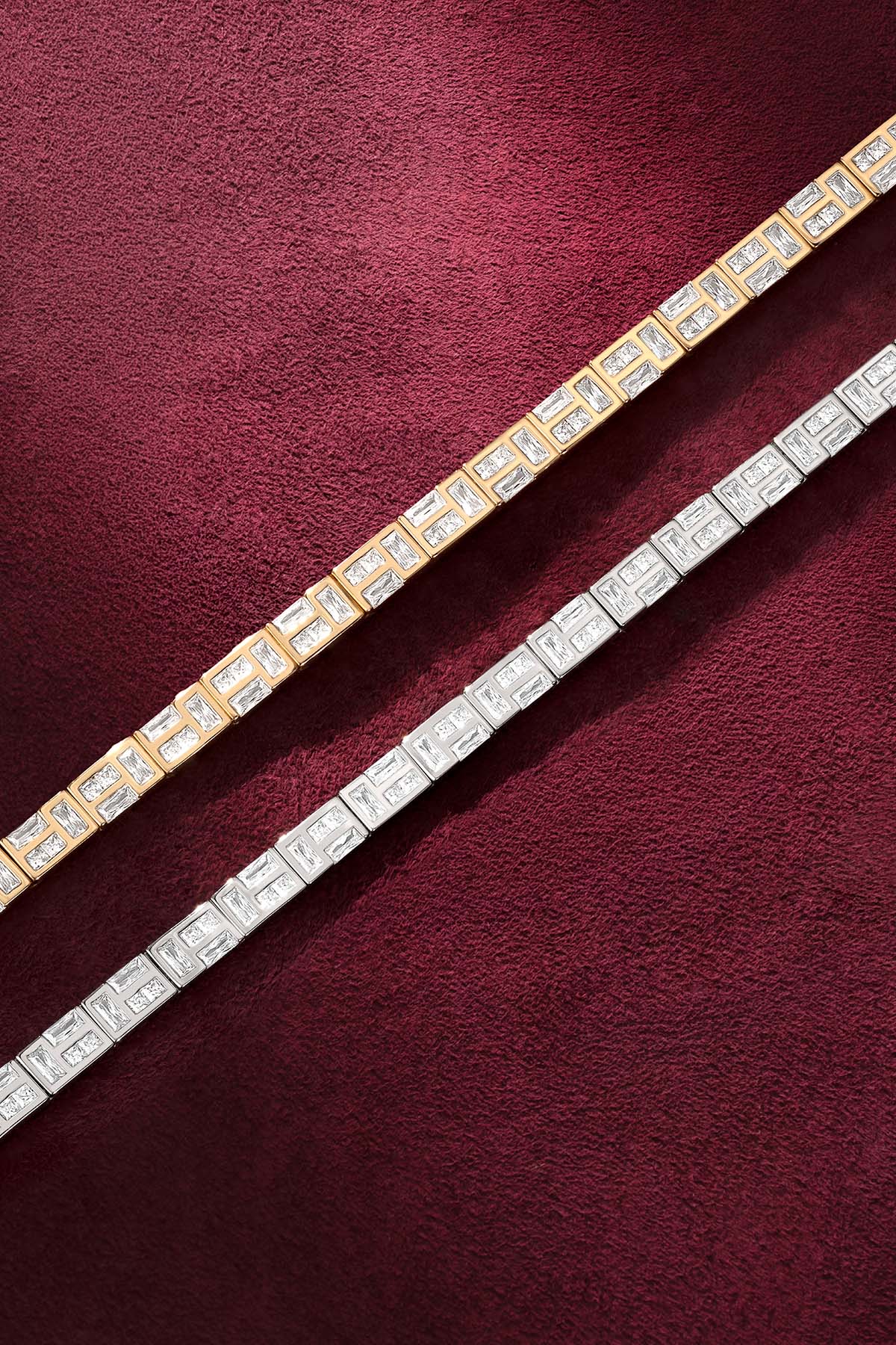 APM Bracelets in two colors, sparkling side by side on velvet elegance.