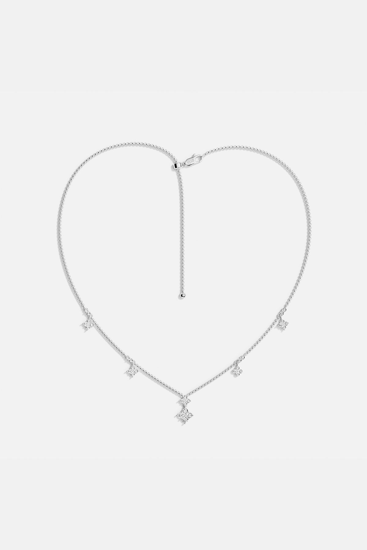 APM Necklace with delicate star charms, a luminous whisper of everyday elegance.