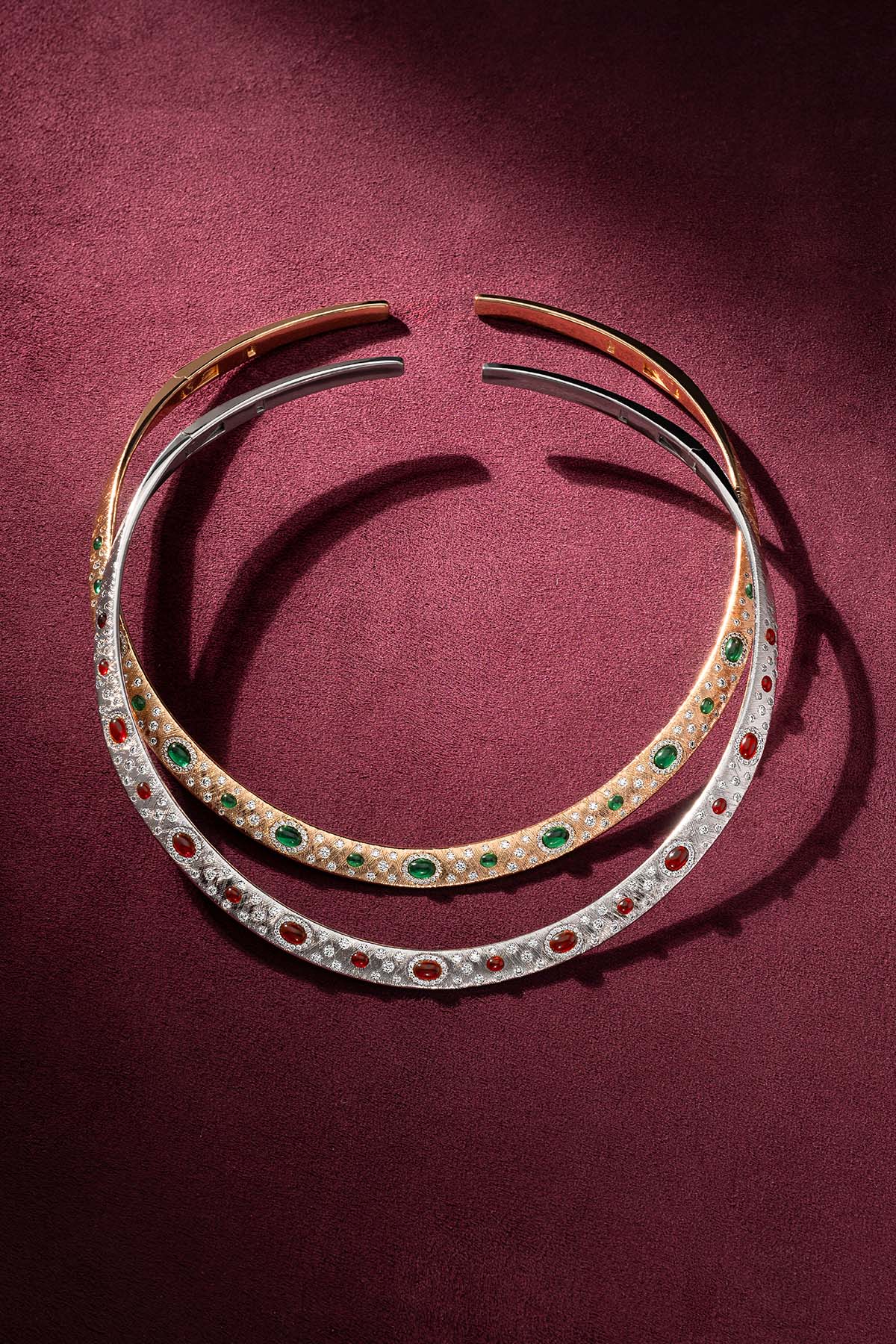 APM Collar Necklaces, a duo of rhodium finish and gold tones, jewel-lit elegance.