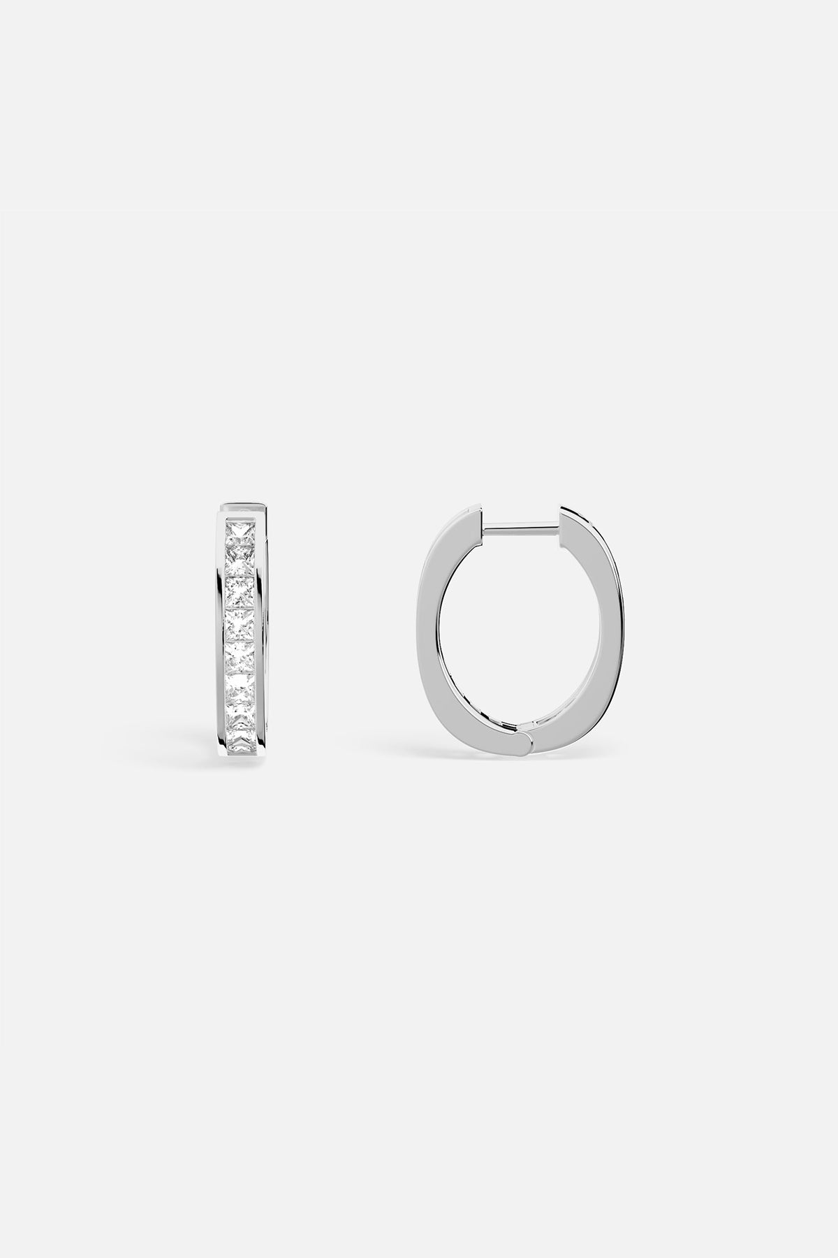 APM Hoop Earrings, a sleek rhodium finish with a quiet, radiant shimmer.