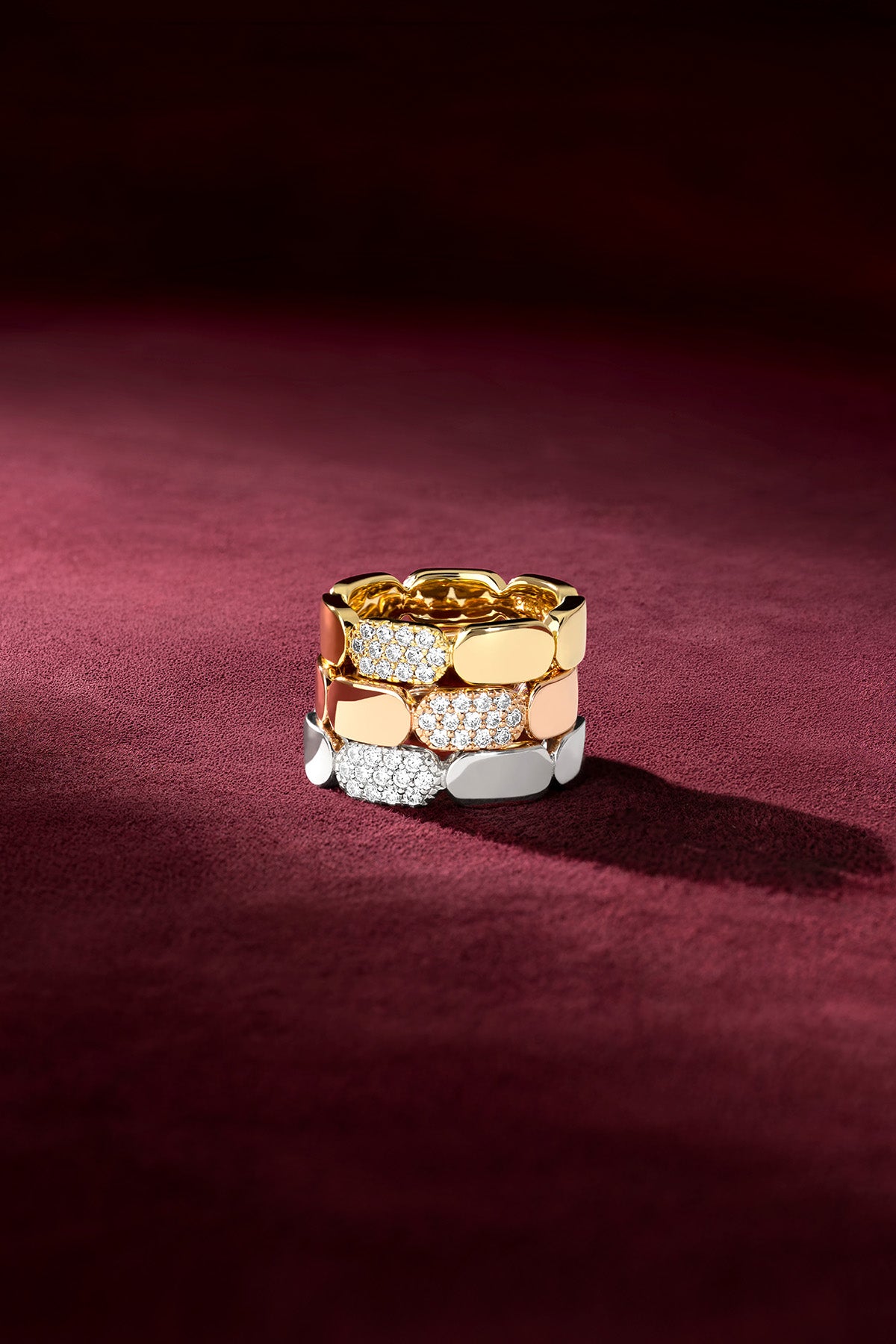 APM Rings stacked in three colors, a radiant trio of quiet confidence.