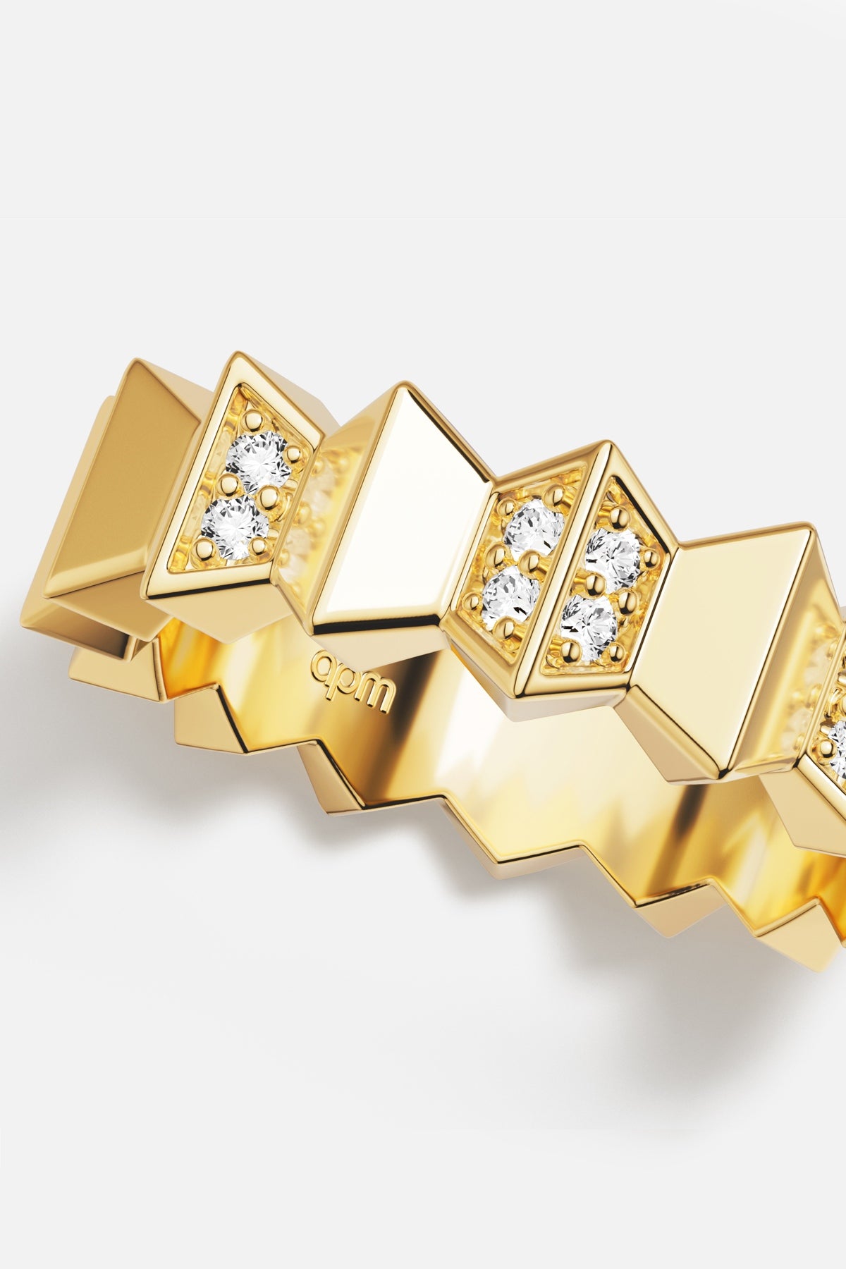 APM Ring in golden color, bold geometry meets a quiet, sparkling edge.