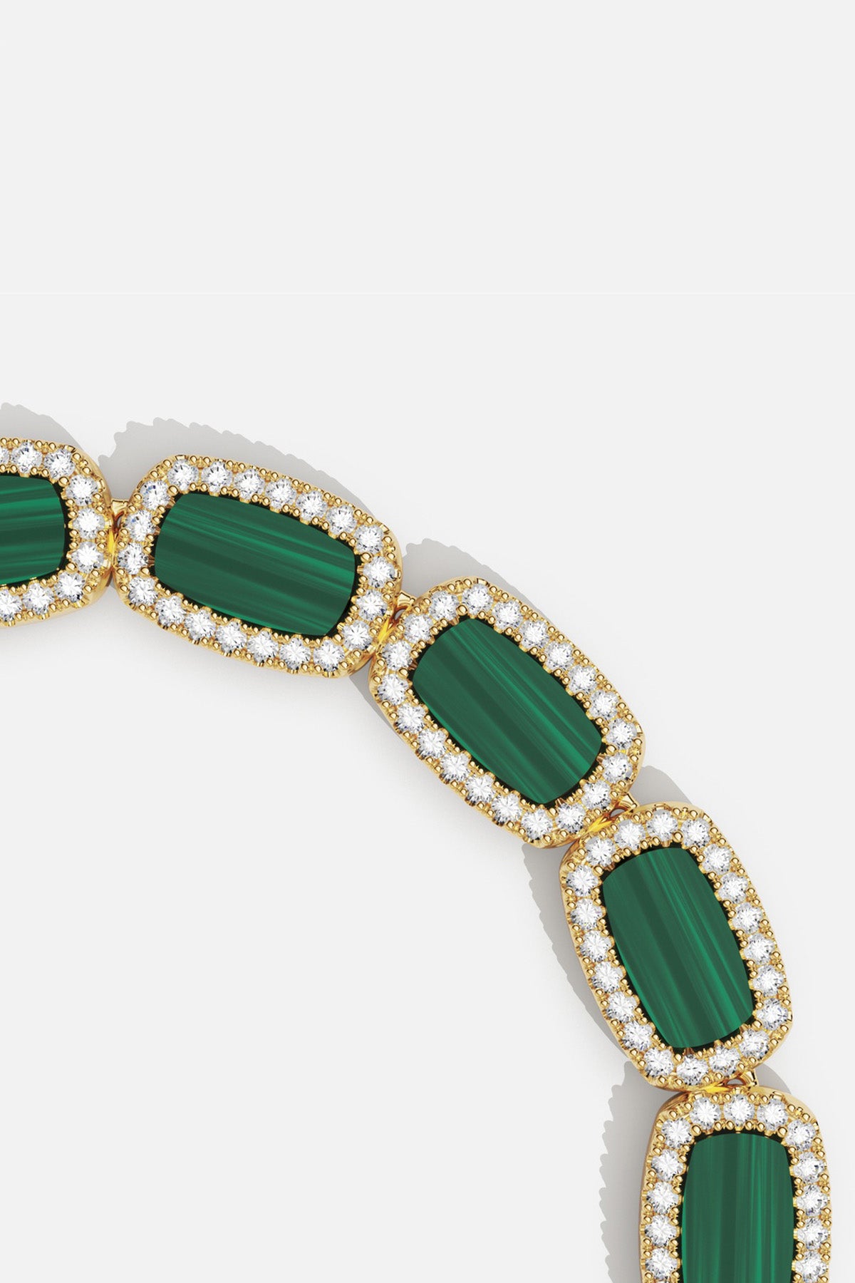 APM Monaco bracelet in golden hues and green stones, radiant everyday elegance.