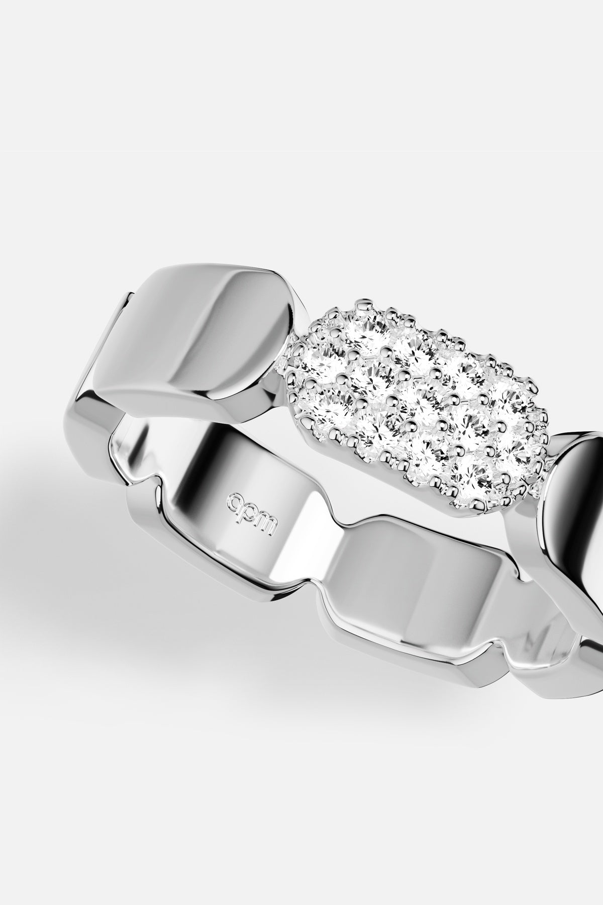 APM Ring in rhodium finish, sculpted links meet a shimmering pavé glow.