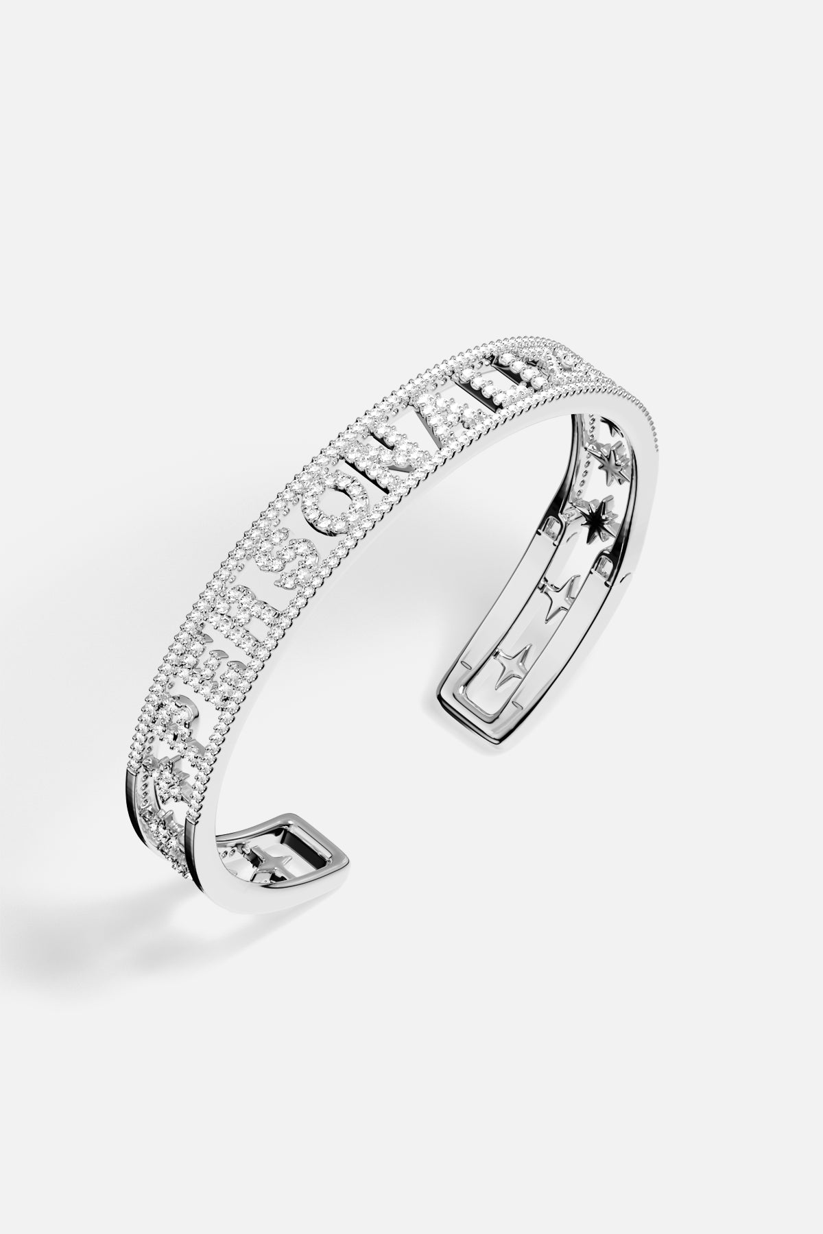 APM Monaco cuff bracelet in rhodium finish, shimmering with starry elegance and quiet confidence.