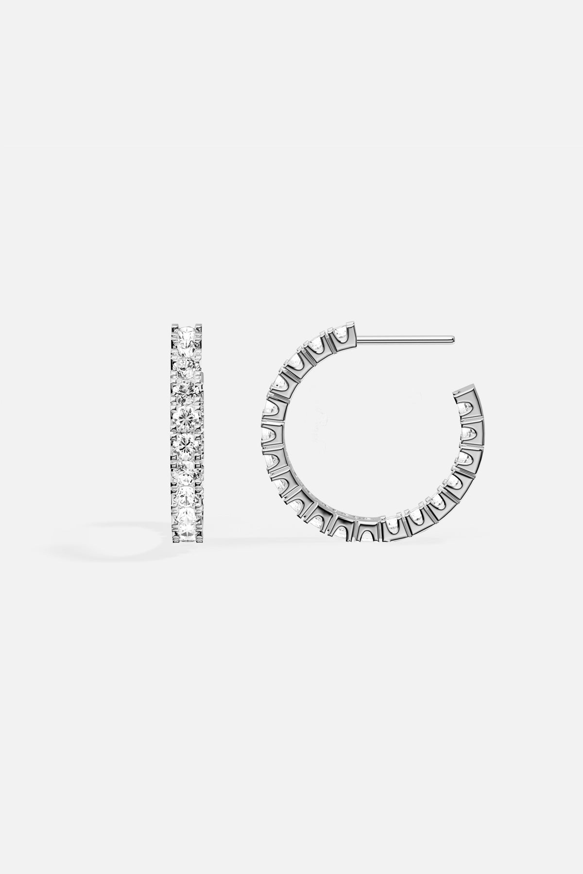 APM Hoop Earrings, a luminous curve of brilliance in rhodium finish.