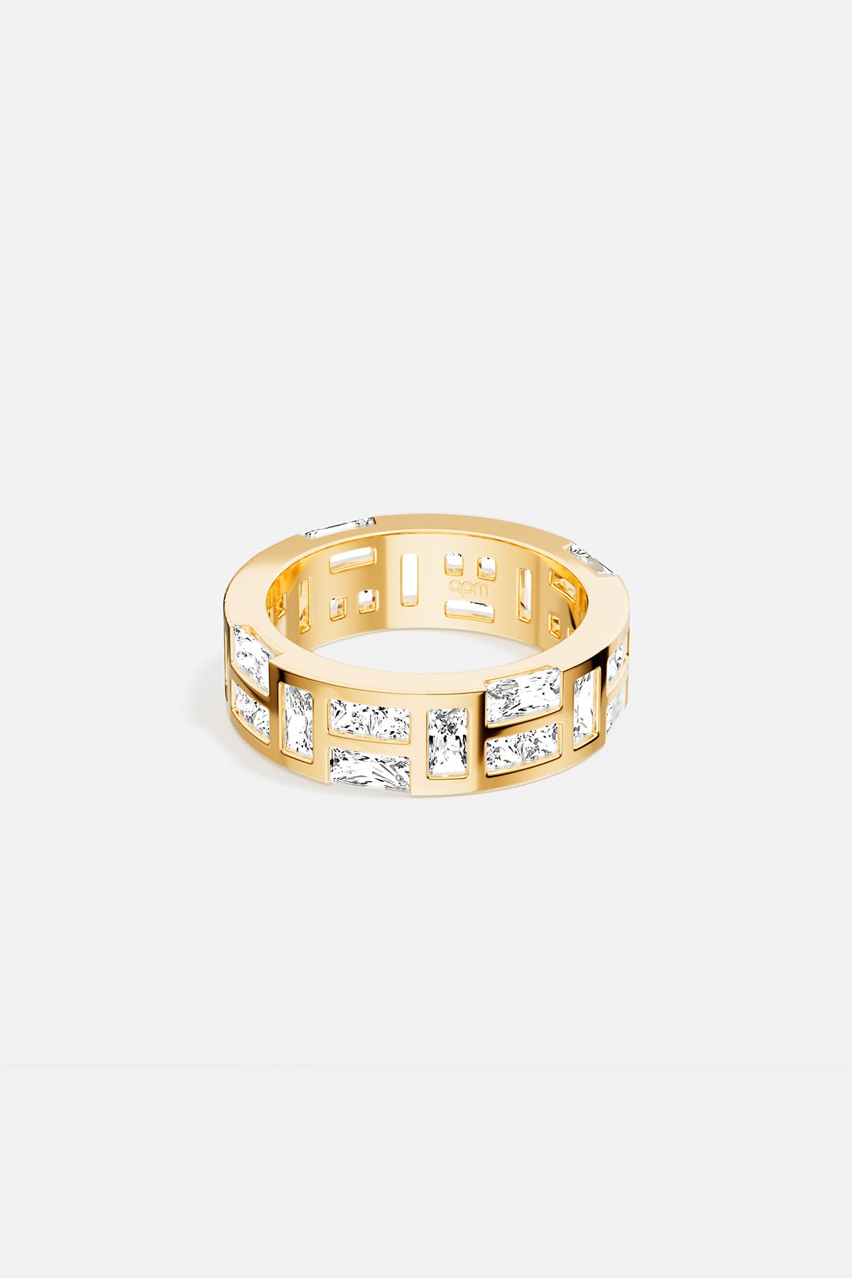 APM Ring in golden color, luminous baguette stones set in bold architectural rhythm.