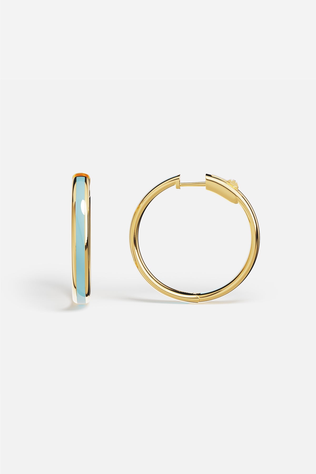 APM Hoop Earrings in golden hue with a soft blue whisper, effortlessly chic.