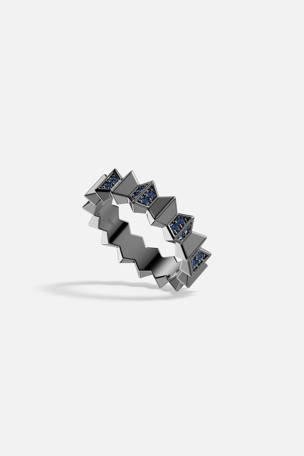 APM Ring in dark rhodium finish, zigzag edges with deep blue sparkle.