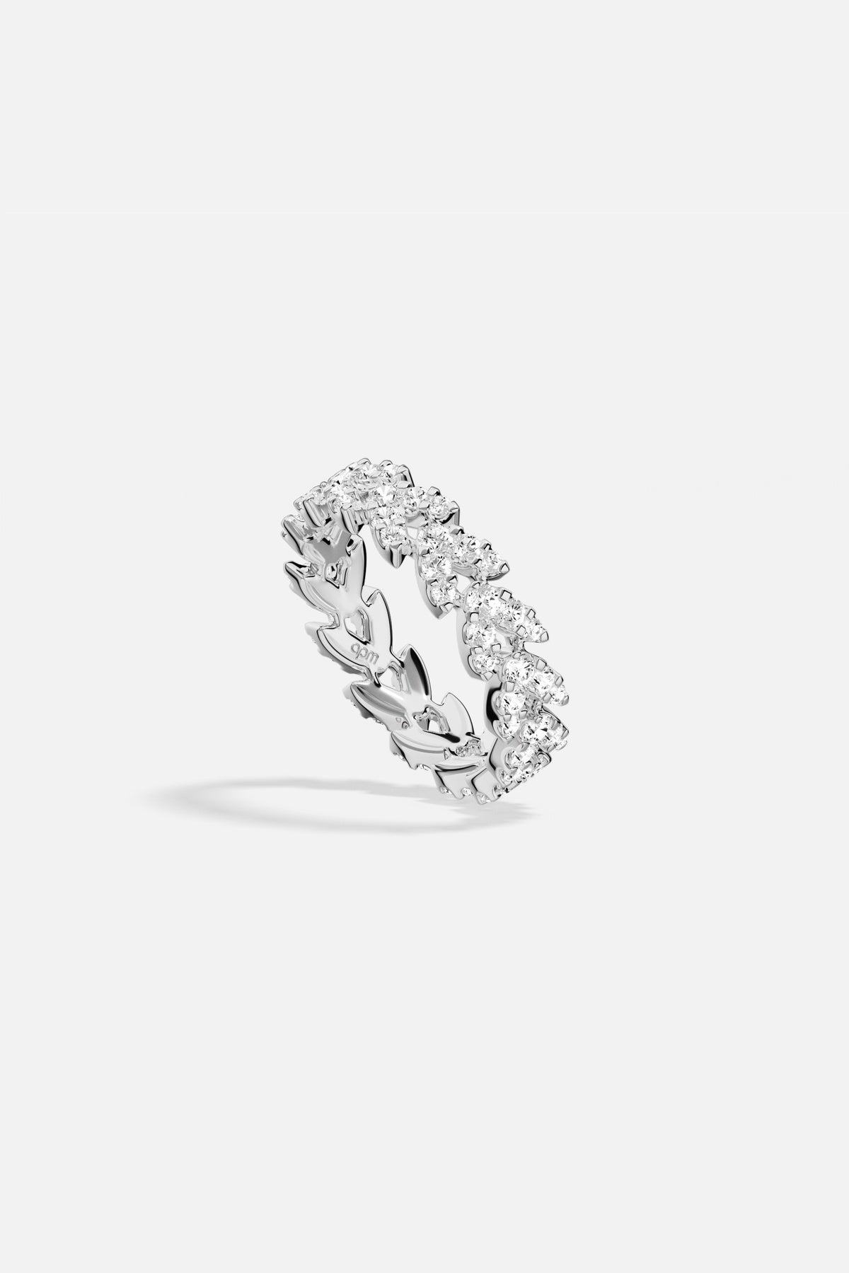 APM Ring, a shimmering laurel of light in rhodium finish.