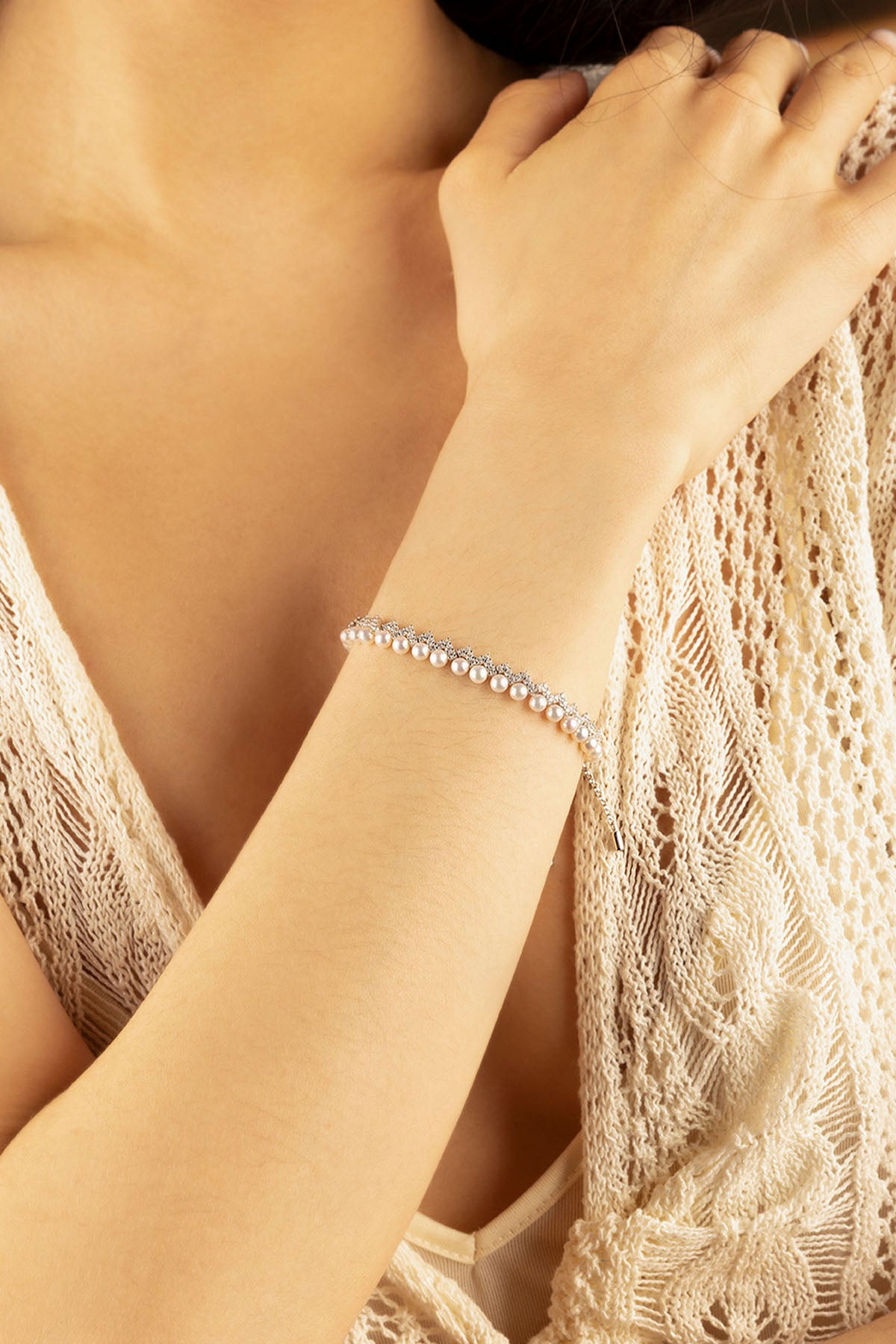 APM Monaco Up and Down Adjustable Bracelet with Pearls in Silver worn on hand