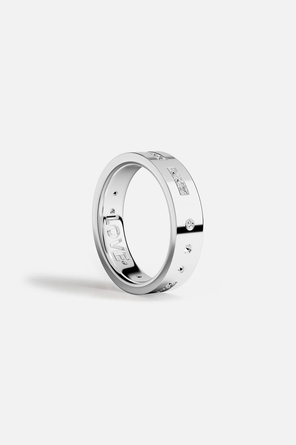 Rings APM Monaco. White metal ring with pavé diamonds on a slim band that spells out 'LOVE' in morse code.