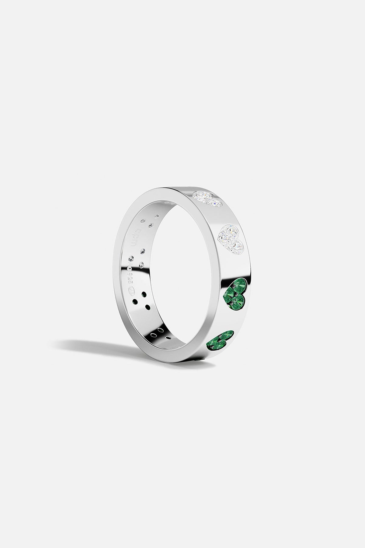 Silver ring with green and white stones on a white background