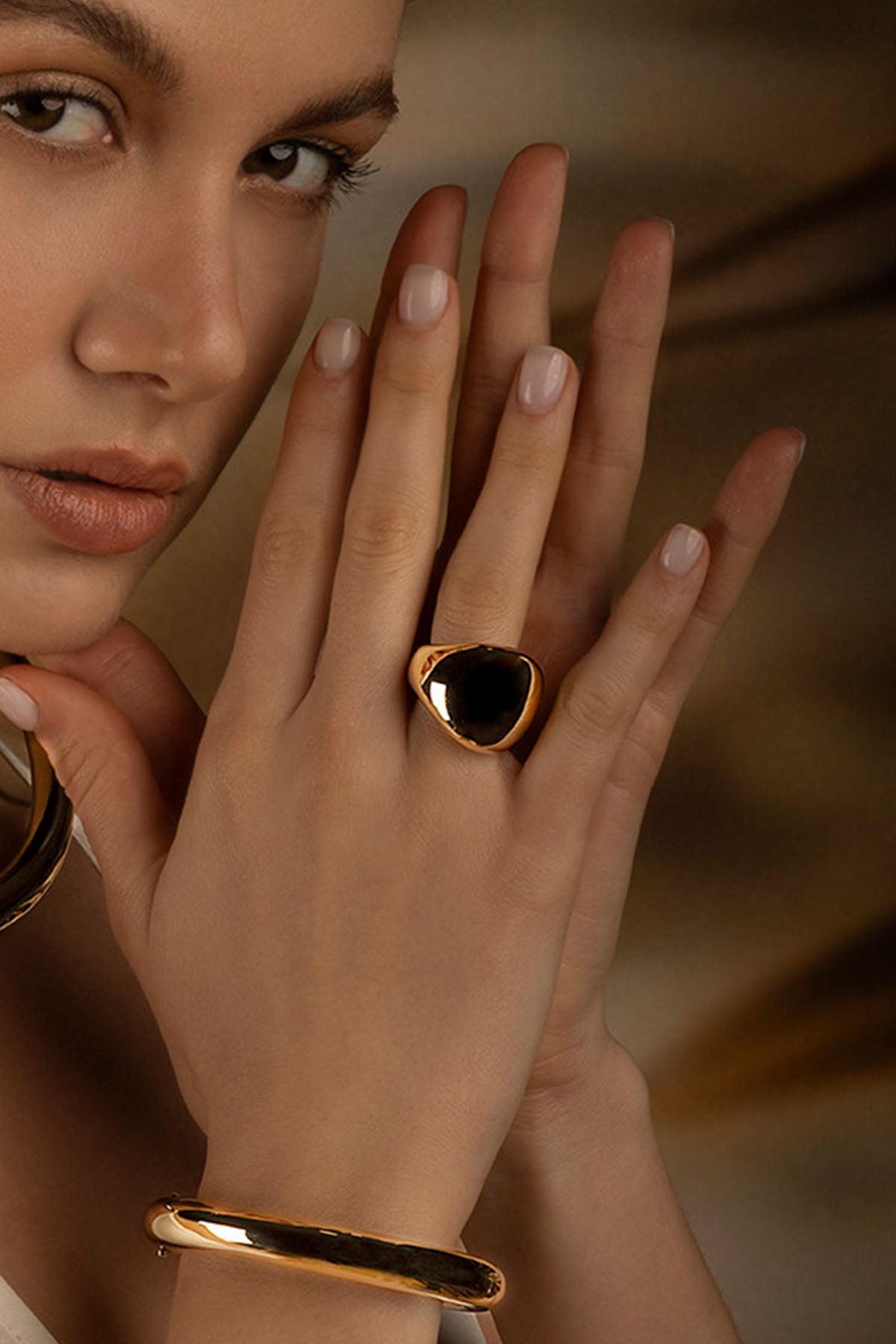APM Monaco Dome Ring in yellow gold worn on hand