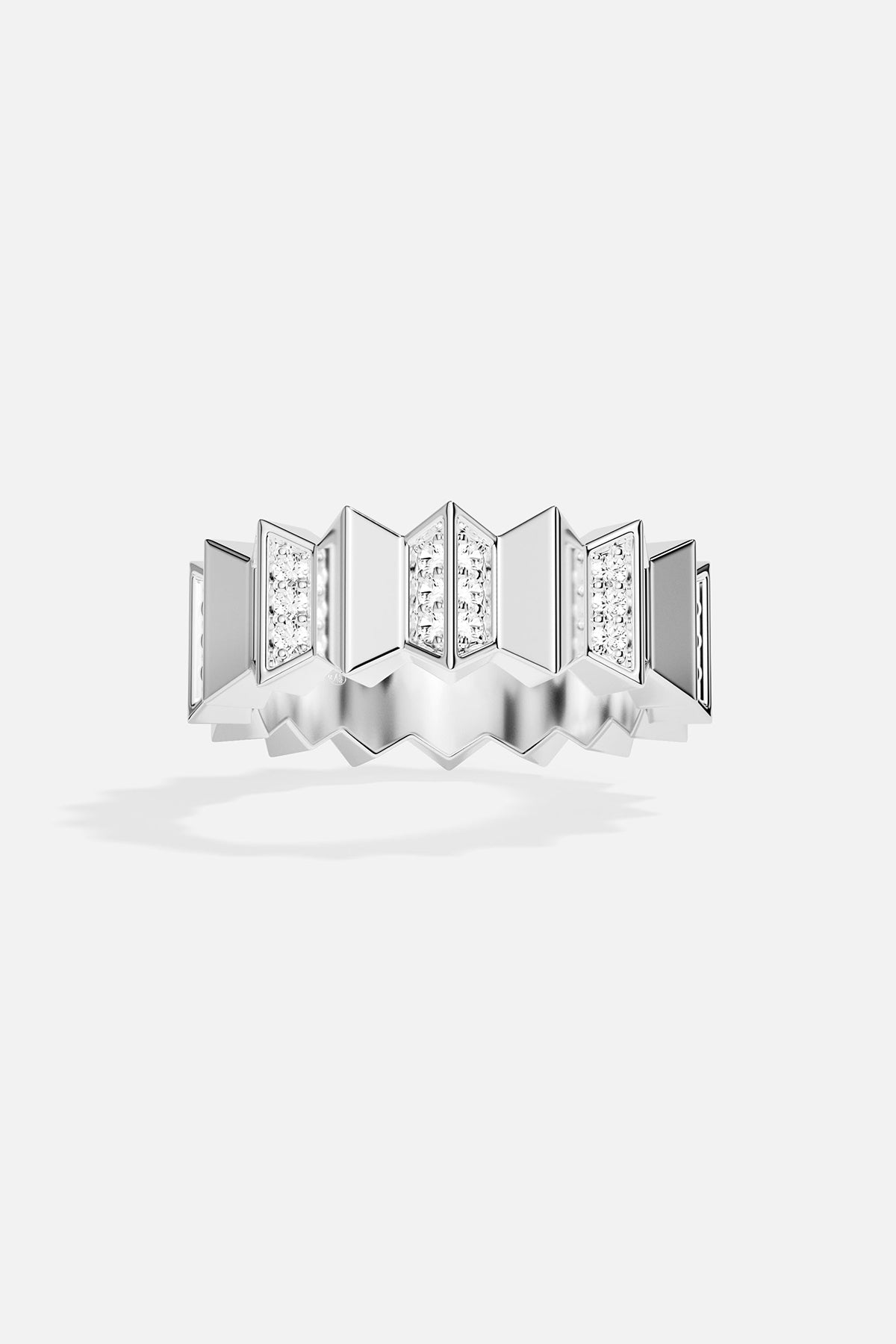 Silver ring with white stones on a white background