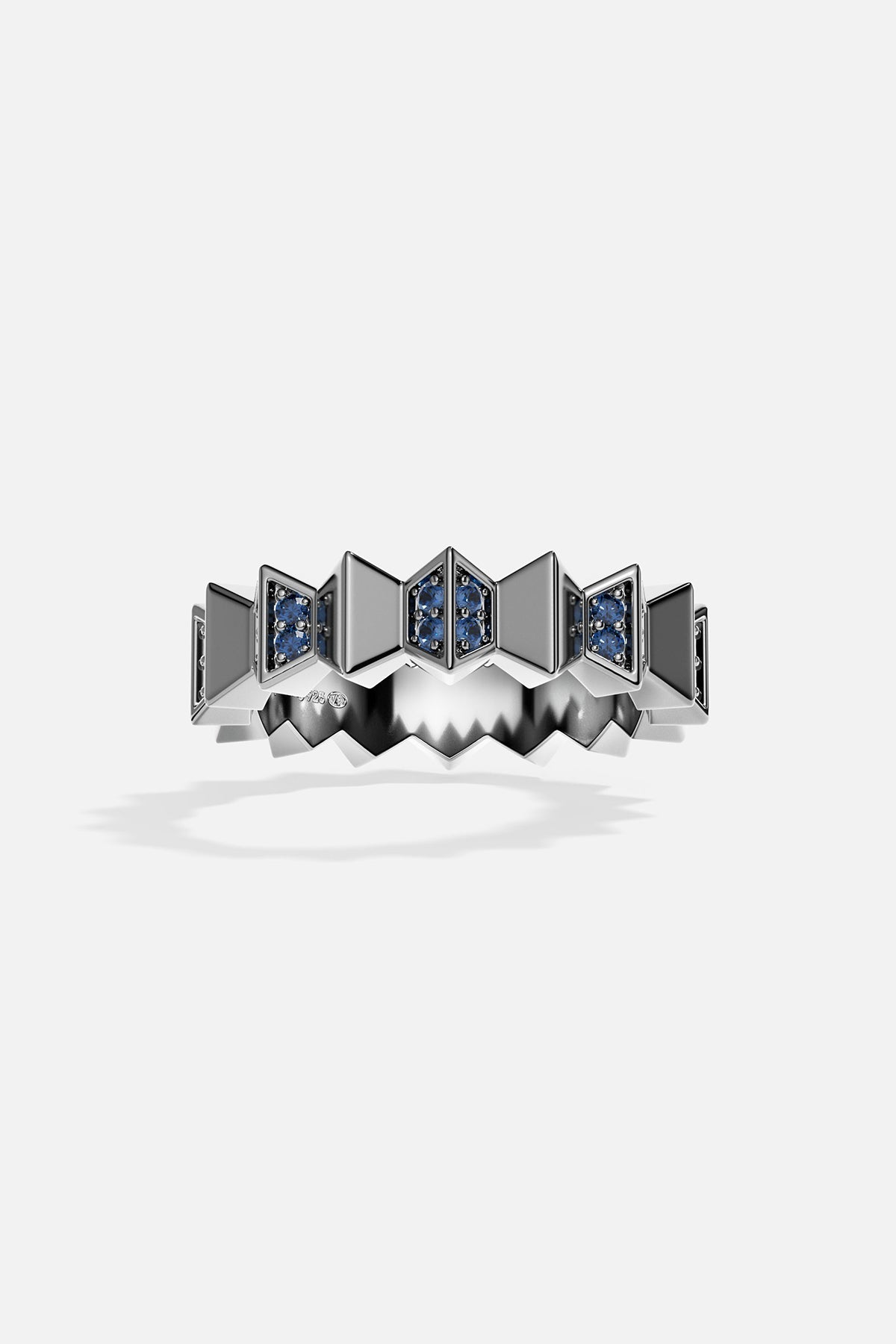 Silver ring with blue stones on a white background