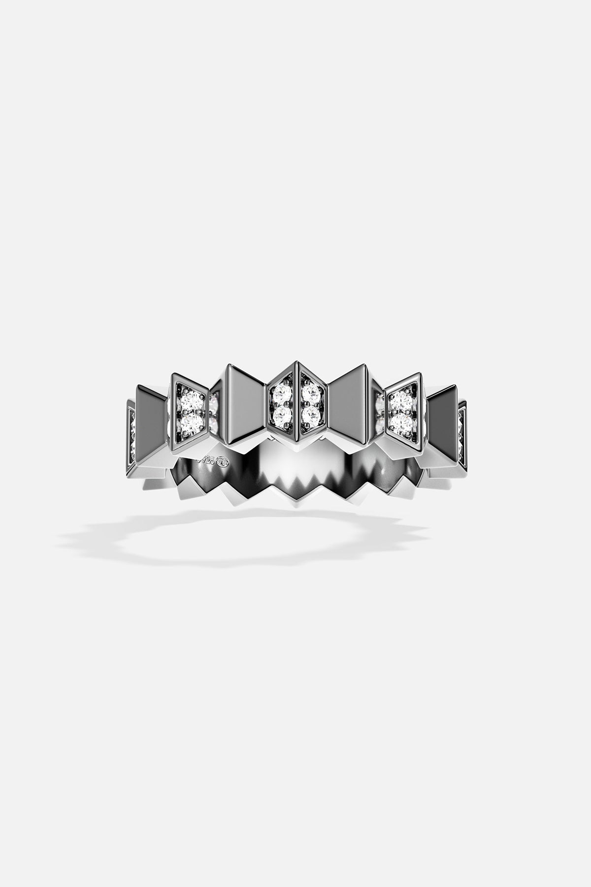Silver ring with geometric design on a white background