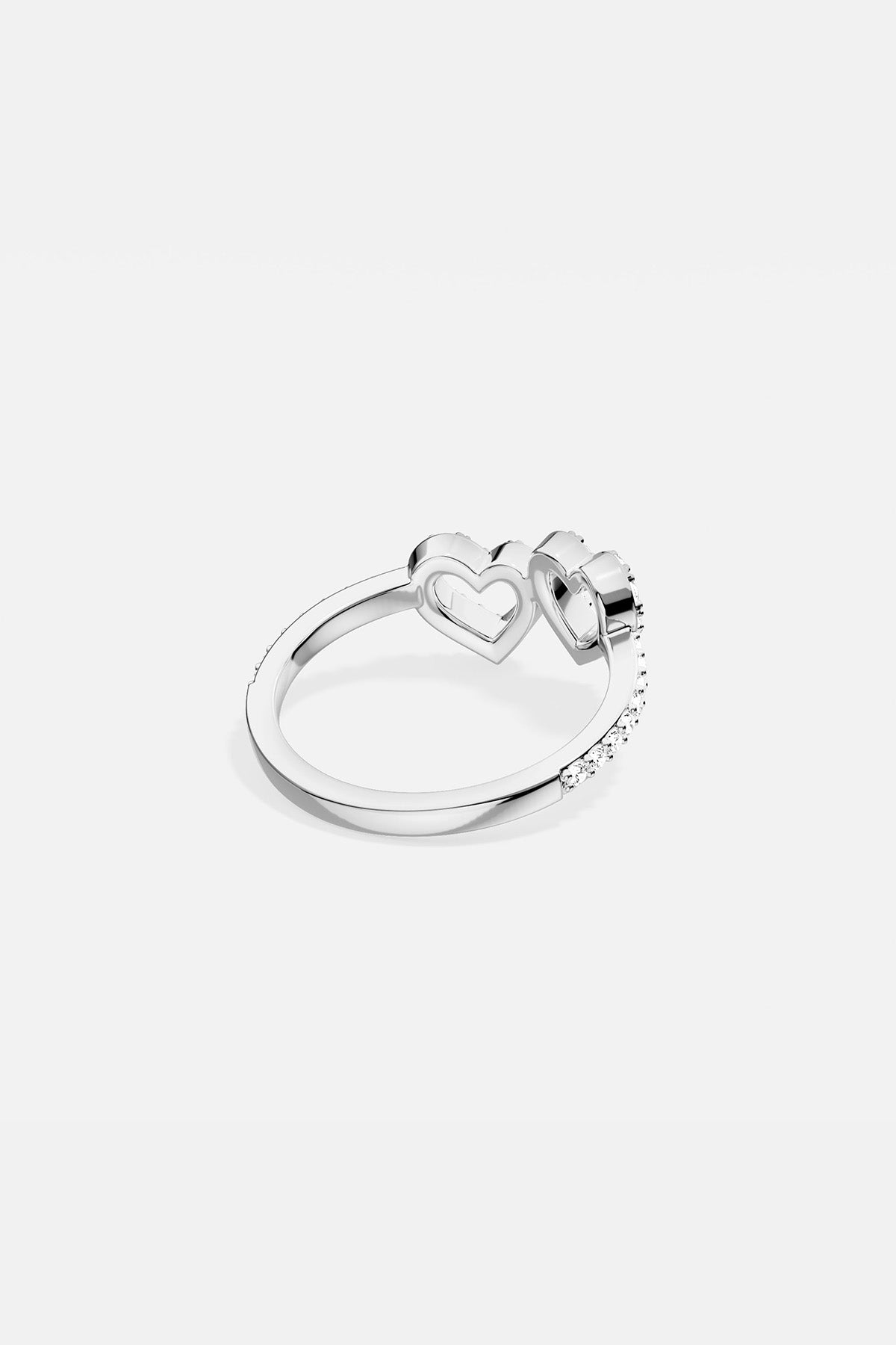 APM MONACO silver ring with two heart-shaped designs on a white background