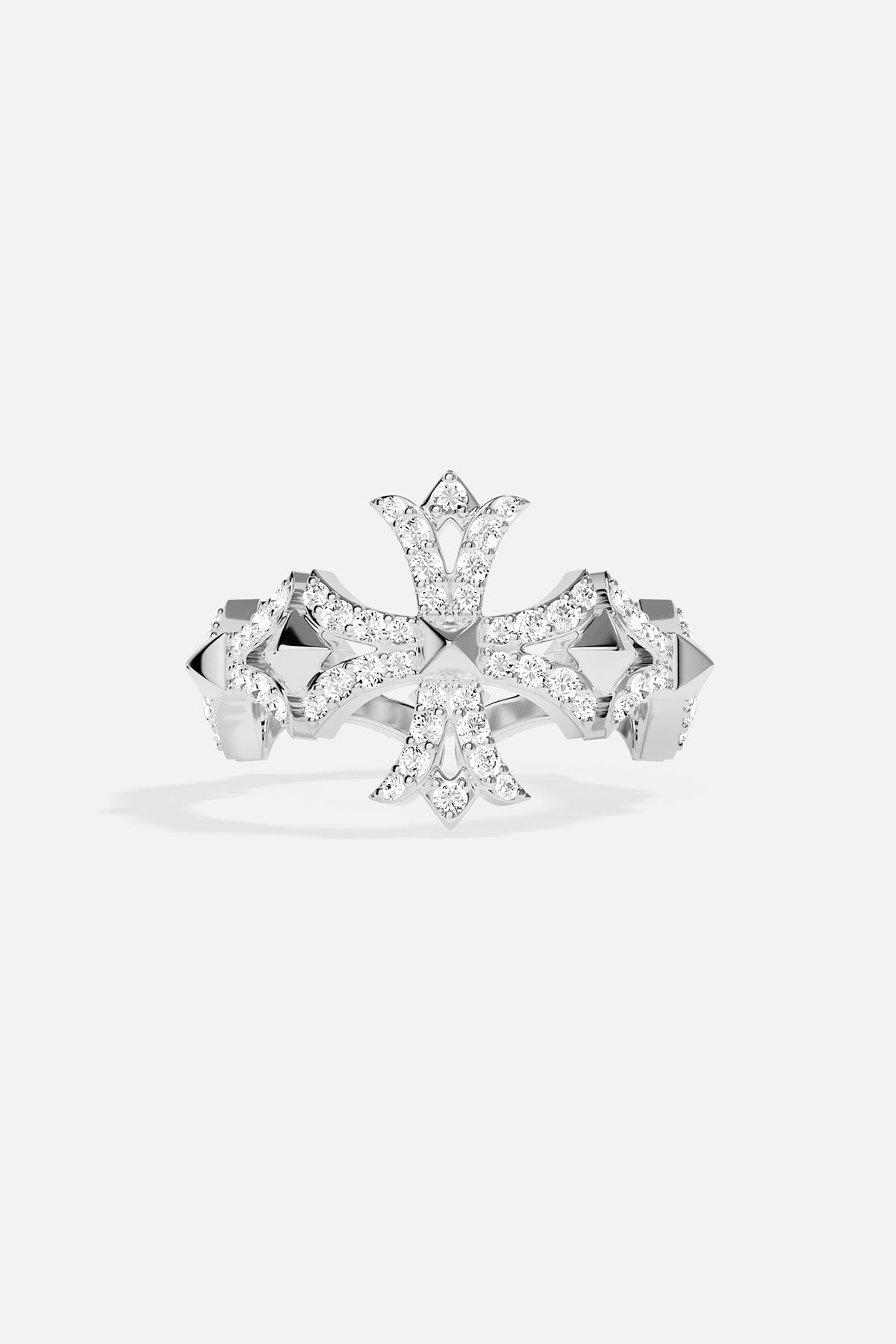 Silver ring with cross-shaped design on a light grey background
