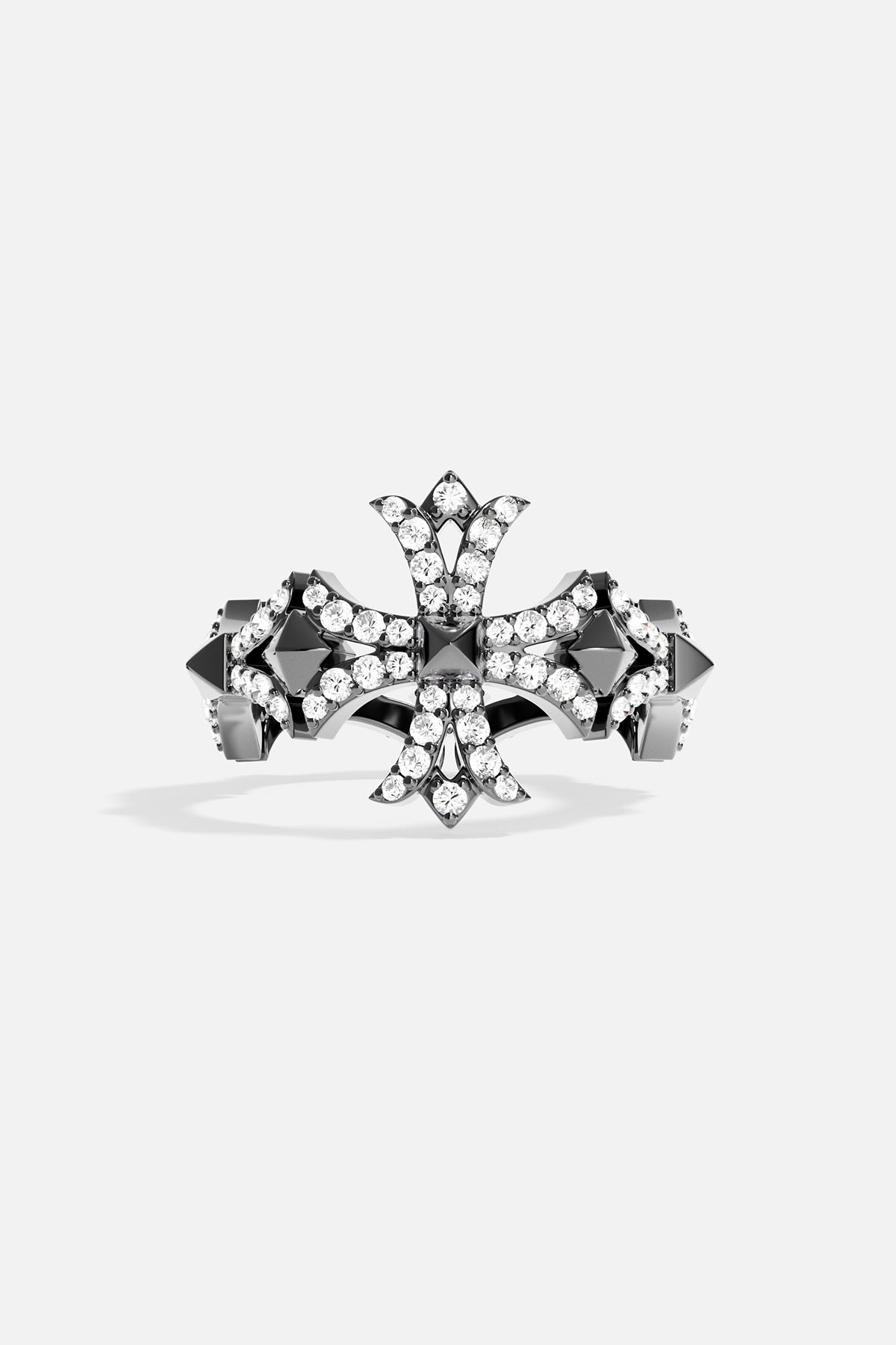Dark grey silver ring with cross-shaped design on a light grey background