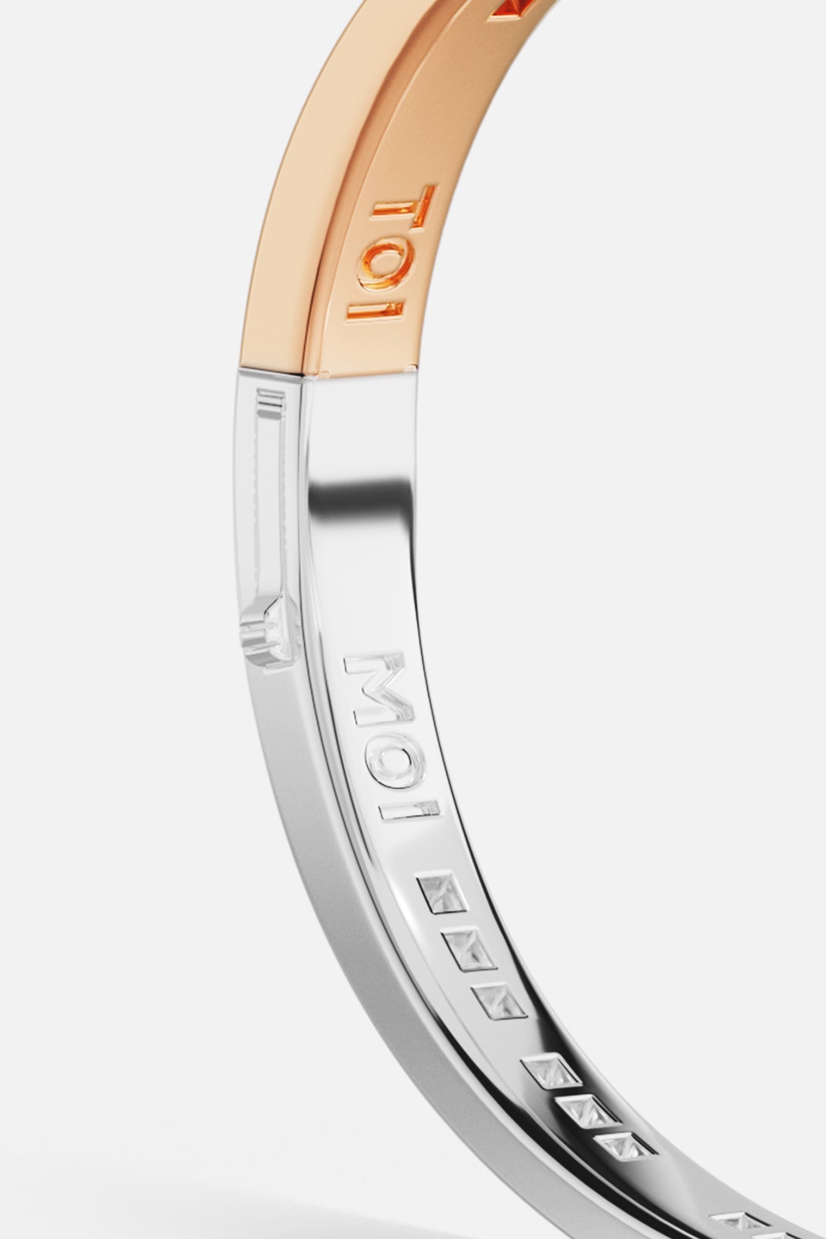 Bracelets APM Monaco. Two-toned gold and silver bangle bracelet engraved MOI 101.