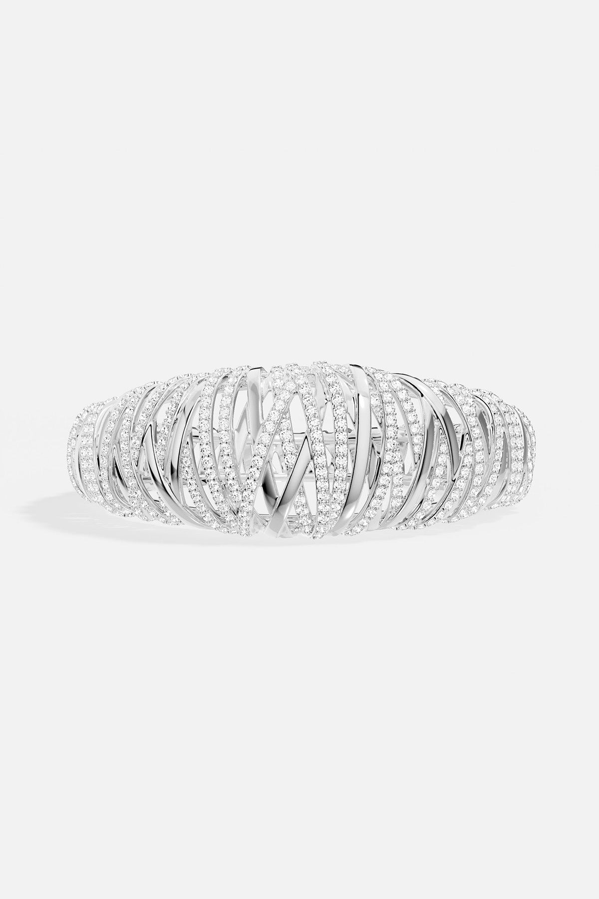 APM MONACO enlace bracelet in silver with clear white stones on a white background