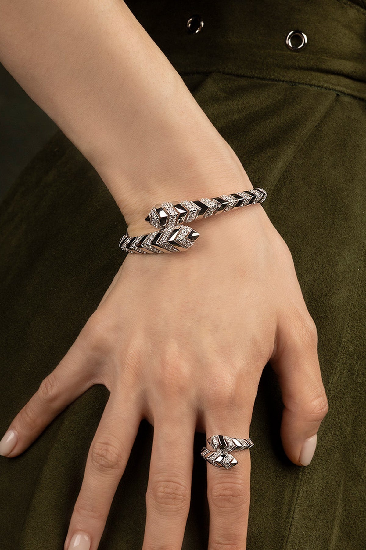 Silver bracelet and ring on a hand 