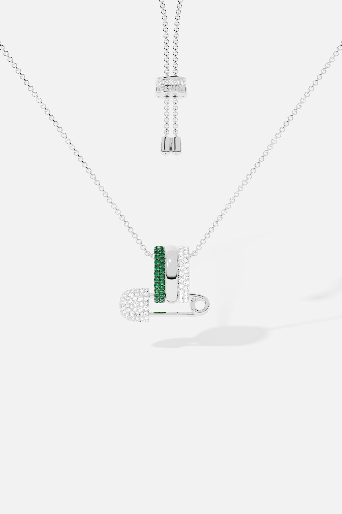 Necklace with a pendant featuring green stones on a white background