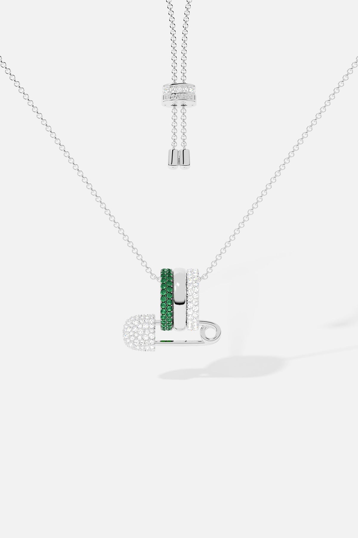 Necklace with a pendant featuring green stones on a white background