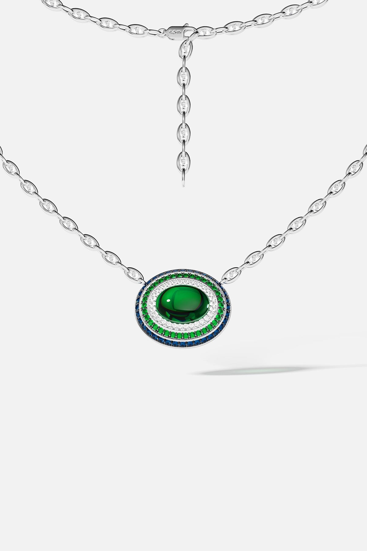 Silver necklace with a green stone pendant on a white background
