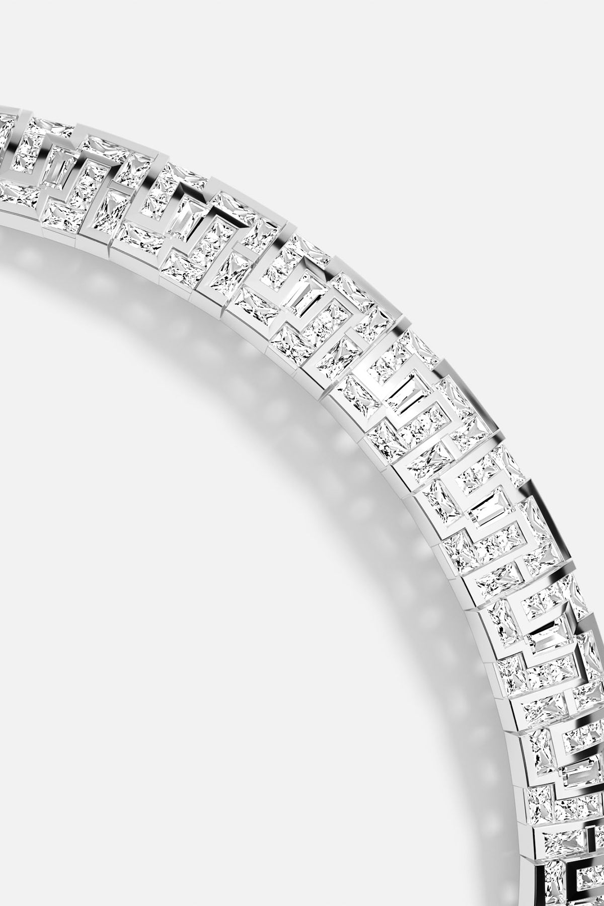 Close-up of APM MONACO labyrinth necklace in silver on a white background