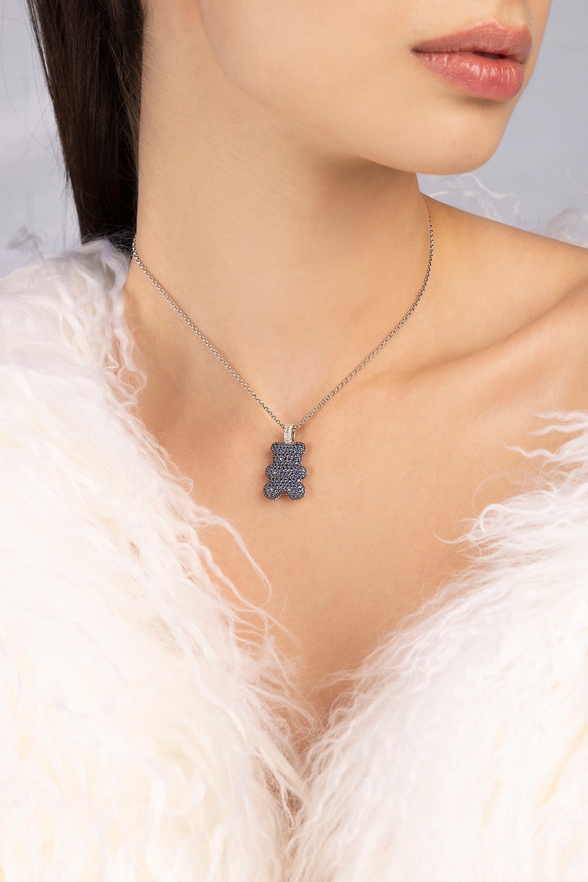 APM MONACO adjustable necklace with baby yummy bear pendant worn by a model against a neutral background