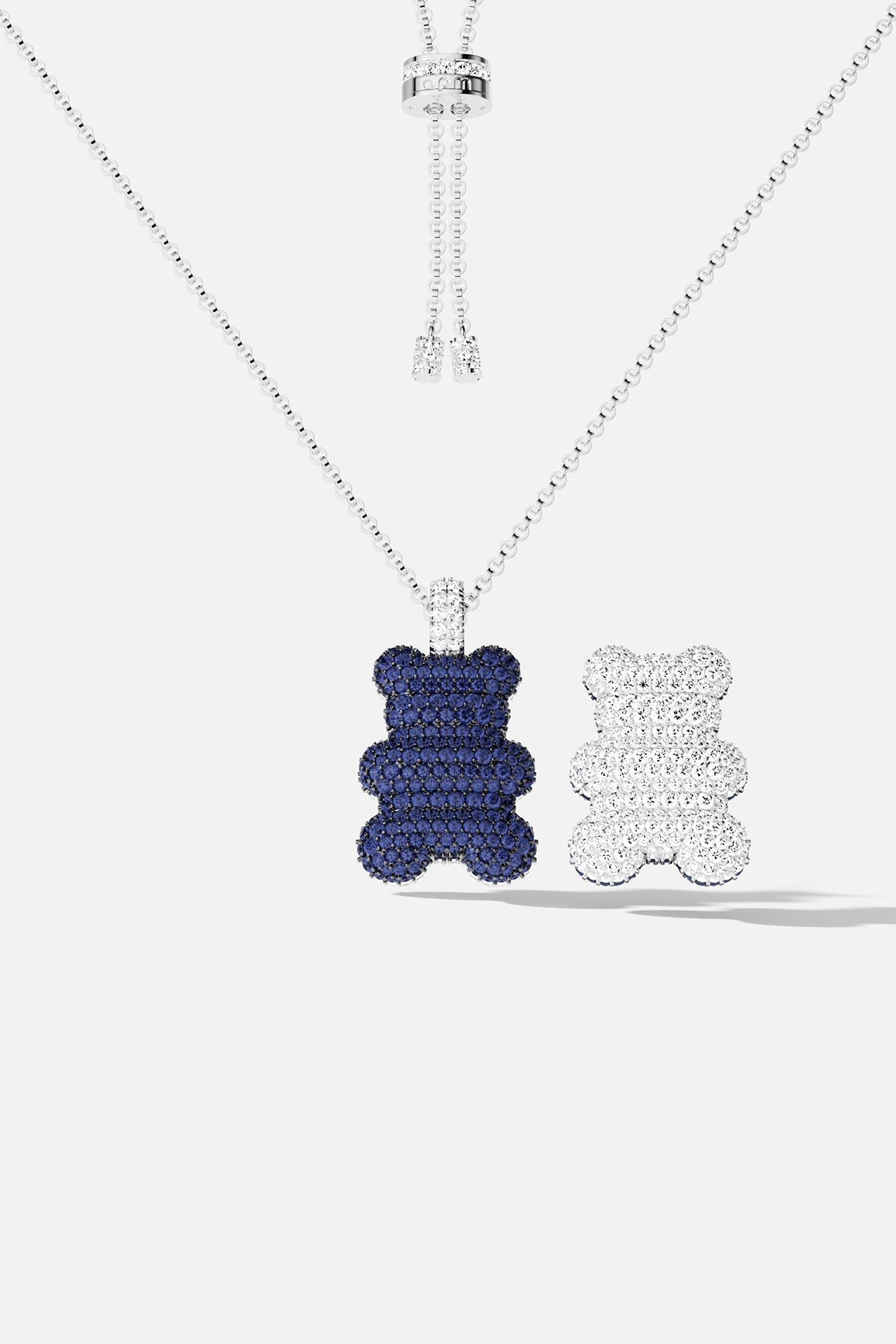 Necklaces APM Monaco; silver chain with two bear-shaped pendants in blue and white.