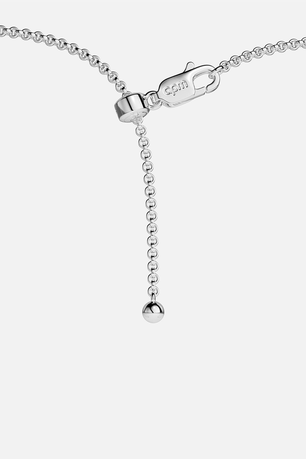 Close-up of APM MONACO silver necklace with blue stones on a white background