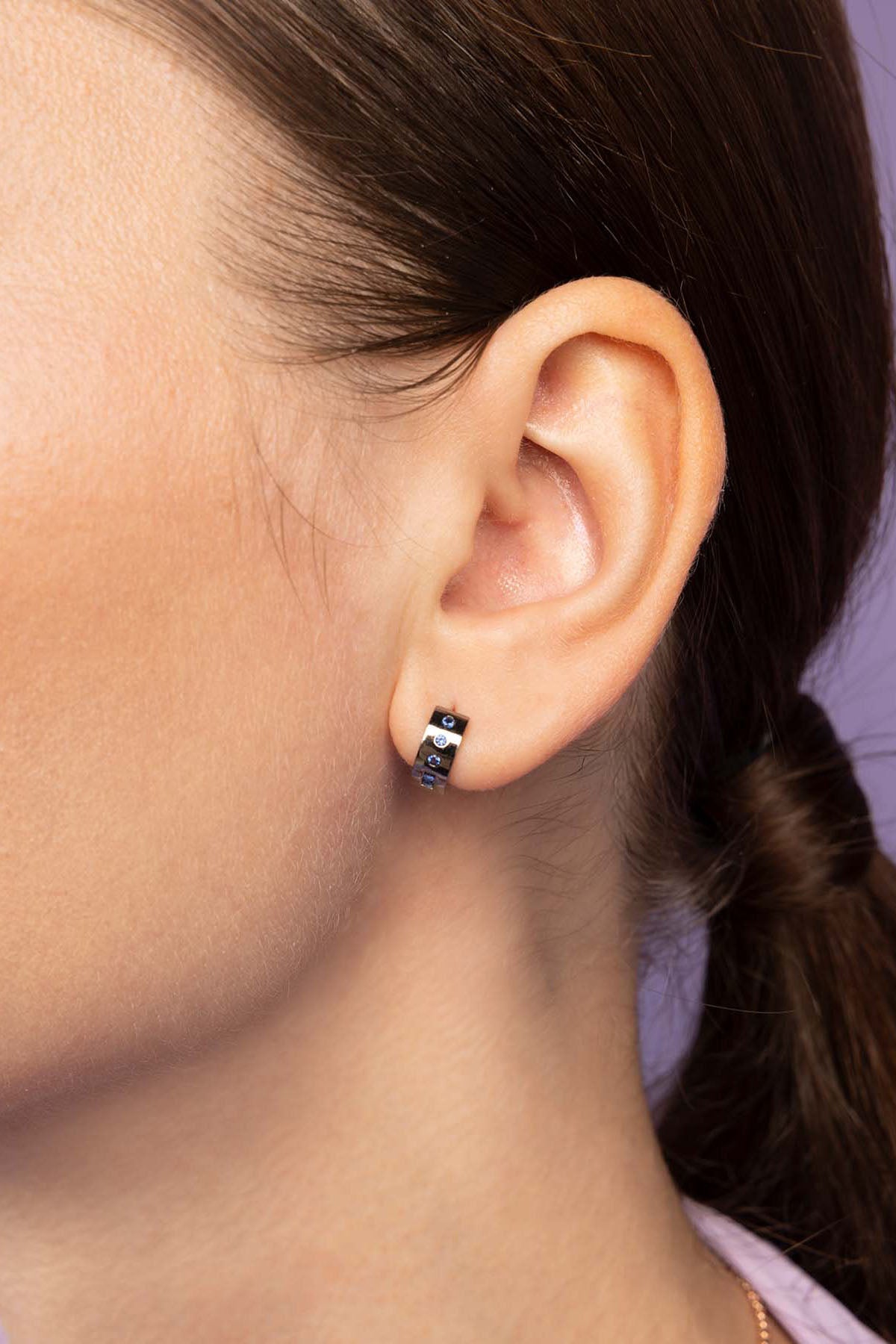 APM Monaco LOVE Morse Code Huggie Earring Worn on ear