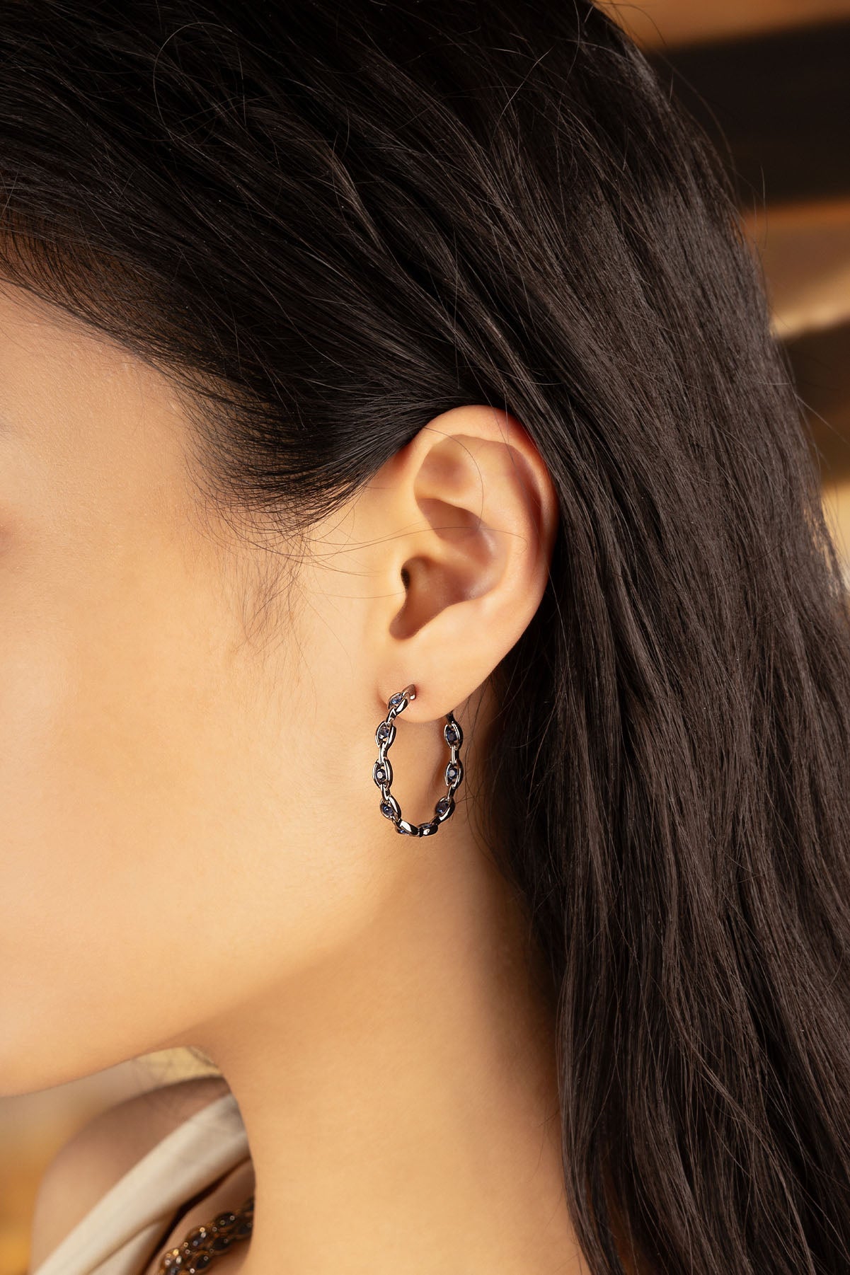 APM Monaco Pavé Chain Earrings in Silver worn on ear
