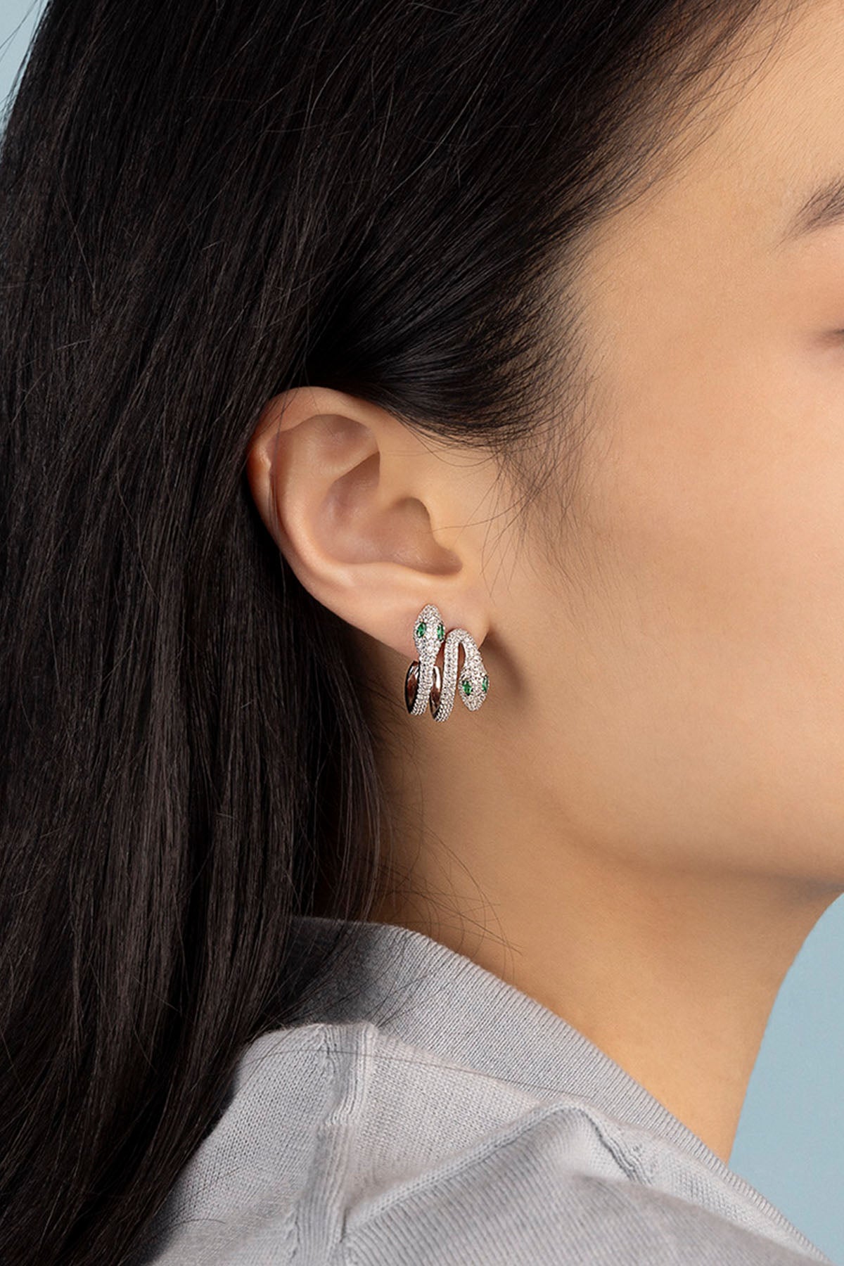 APM Monaco Intertwined Pavé Kaa Earrings in Silver worn on ear
