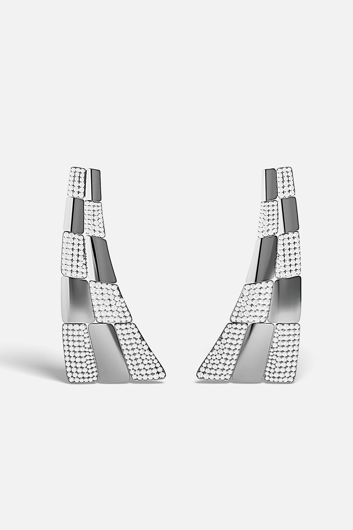 Pair of silver earrings with geometric design on a white background