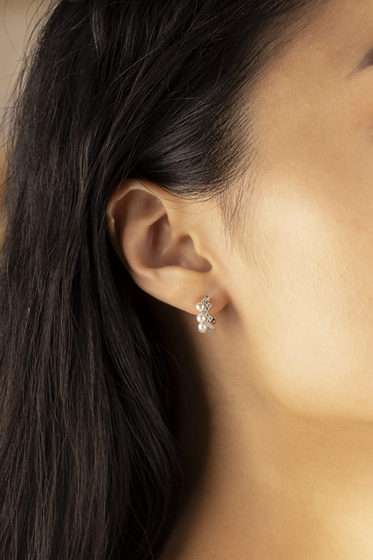 APM Monaco Up and Down Earrings with Pearls worn on ear