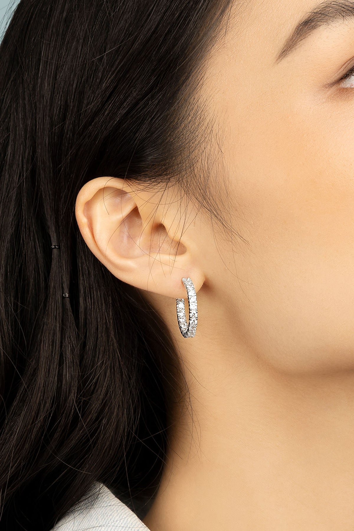 APM Monaco Pavé Hoop Earrings in Silver worn on ear