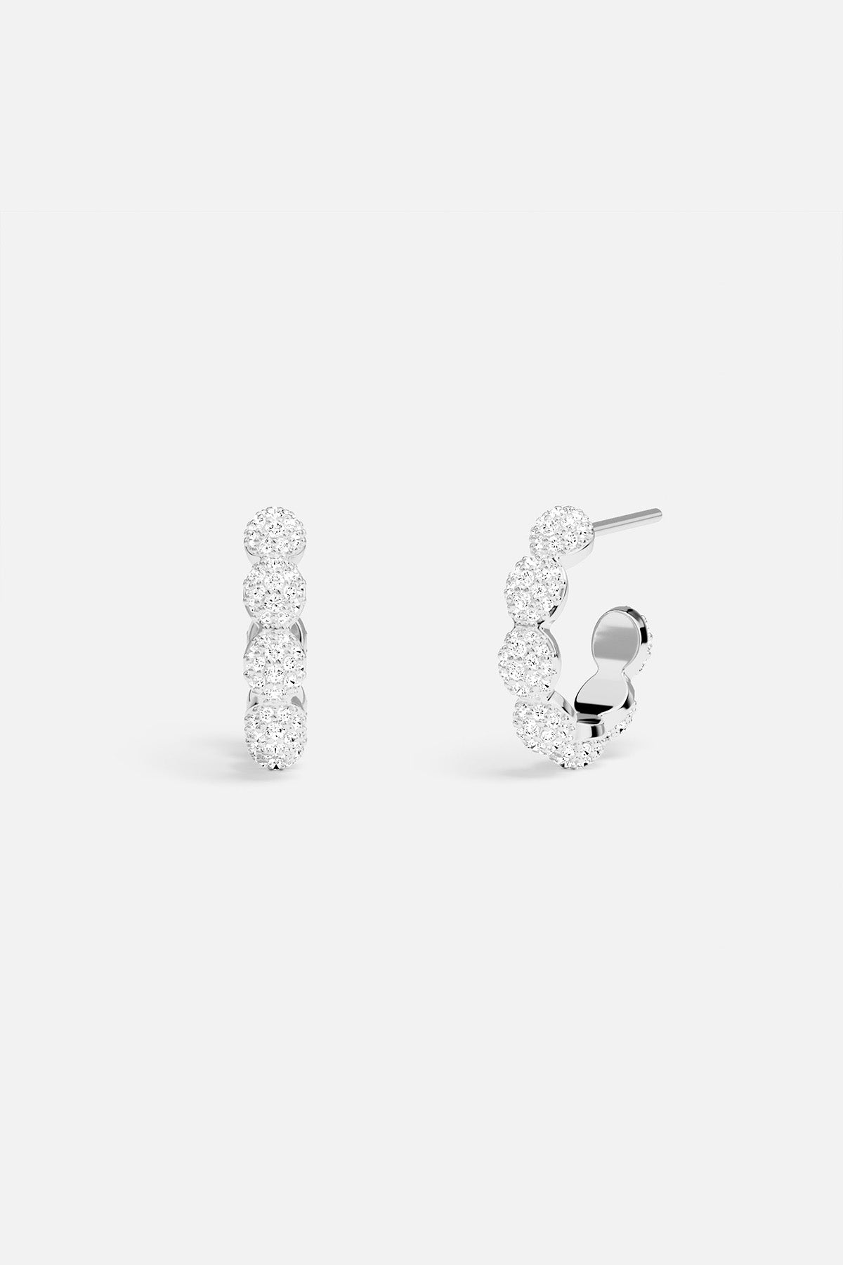 Pair of silver hoop earrings on a white background