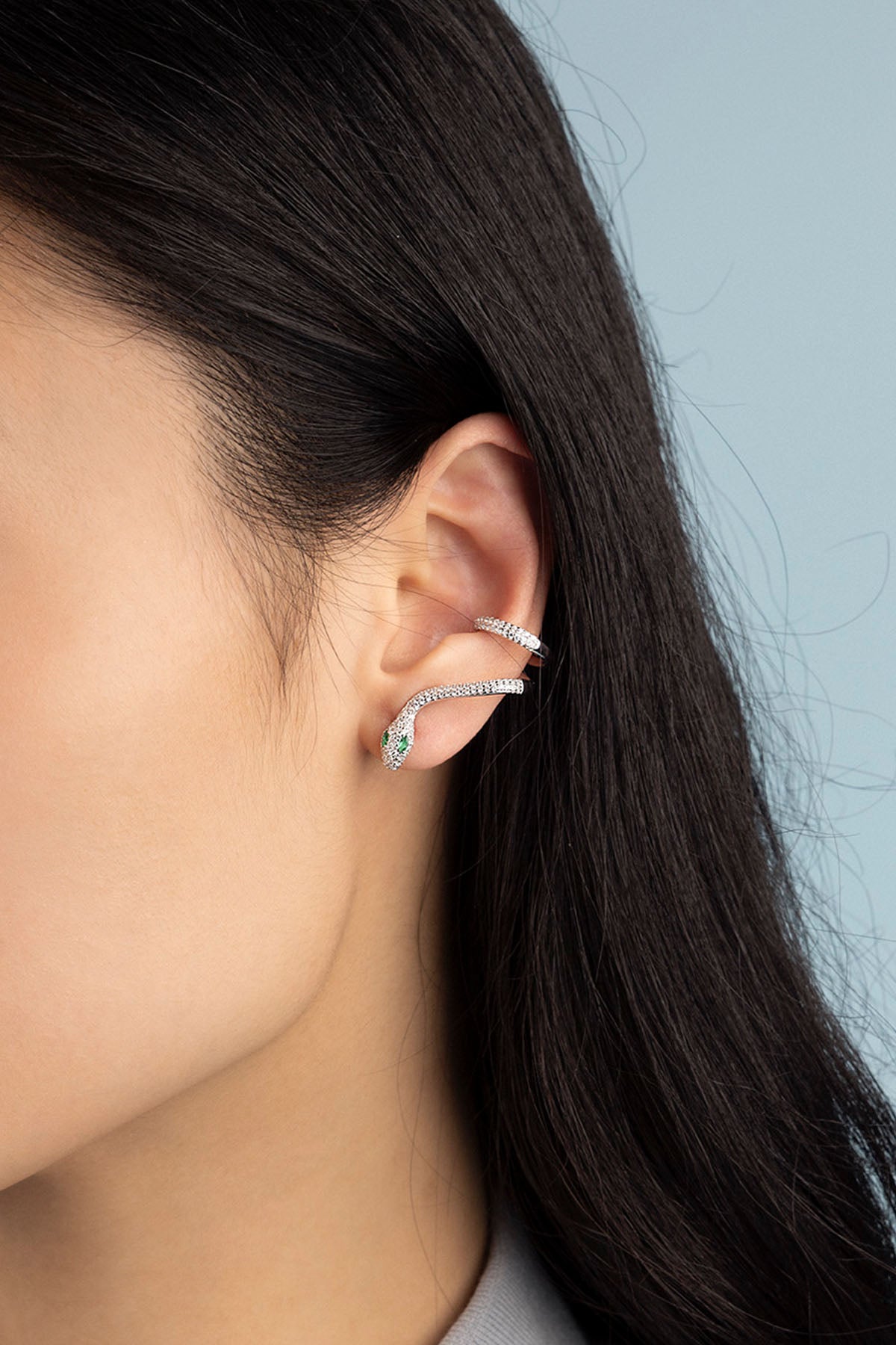 APM Monaco Kaa Single Ear Cuff is silver worn on ear